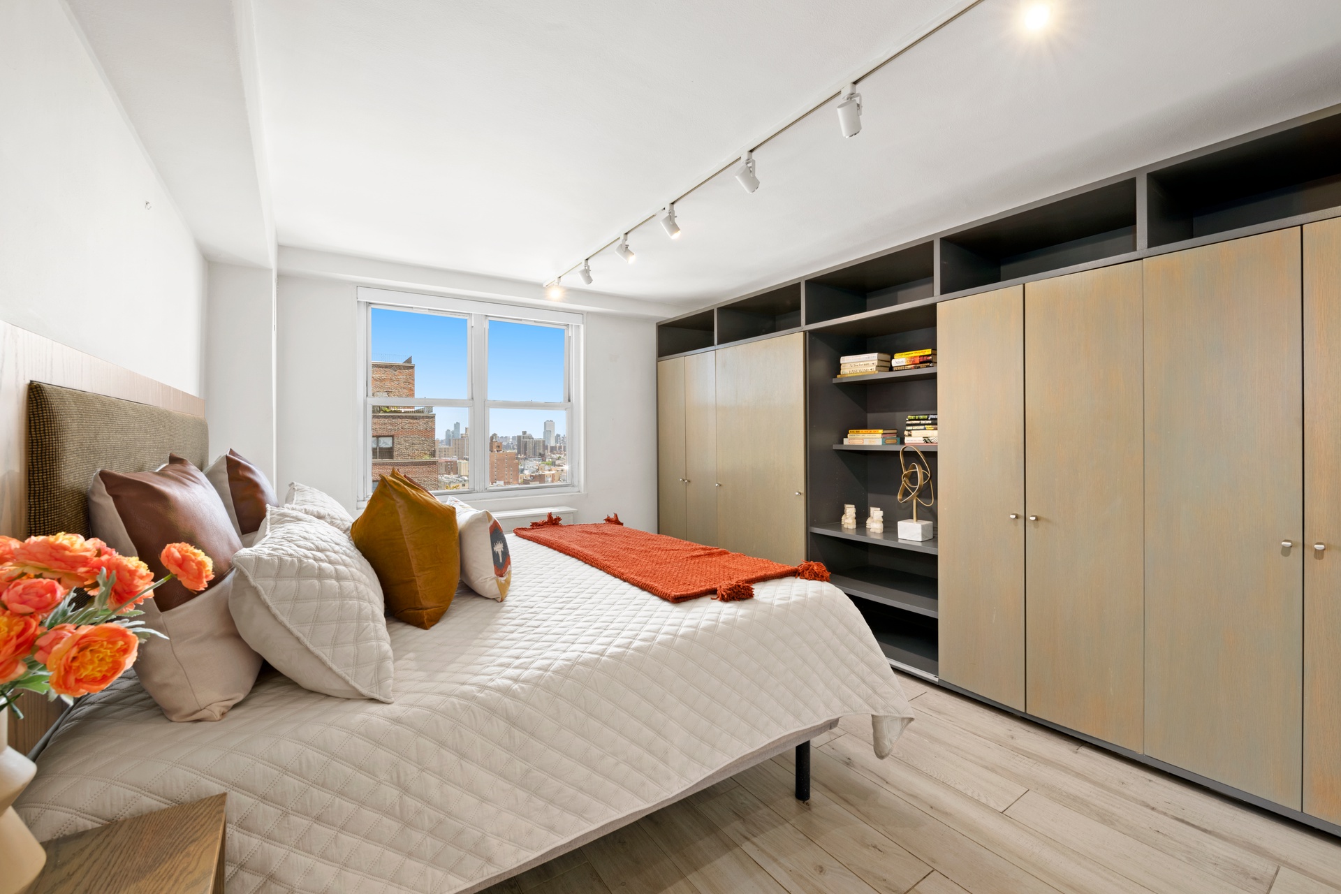 142 East 16th Street, Unit 22B Manhattan, NY 10003 - Photo 11 of 15 a bedroom with a bed and walk in closet