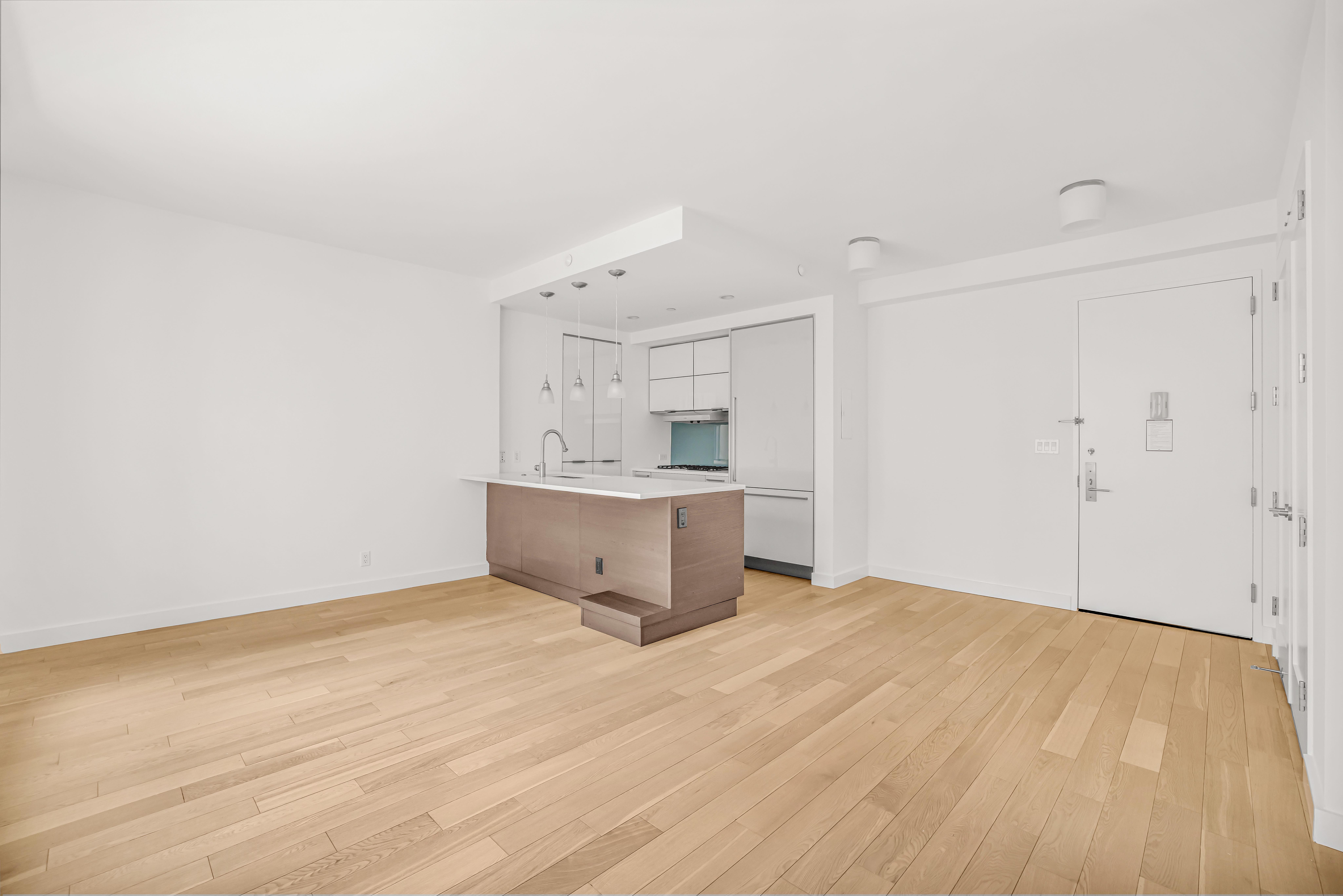 34 North 7th Street, Unit 3Z Brooklyn, NY 11249 - Photo 2 of 14 a view of a kitchen with wooden floor and cabinets