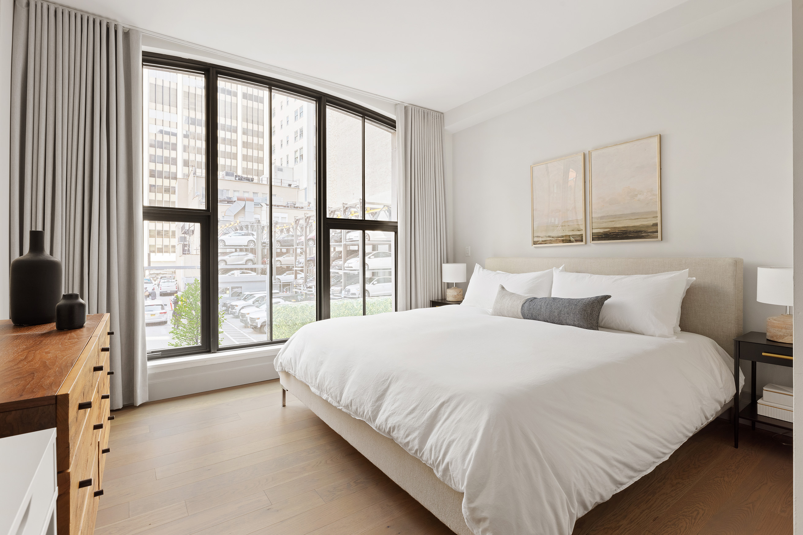 76 Schermerhorn Street, Unit 2C Brooklyn, NY 11201 - Photo 4 of 16 a large bed sitting in a bedroom next to a window