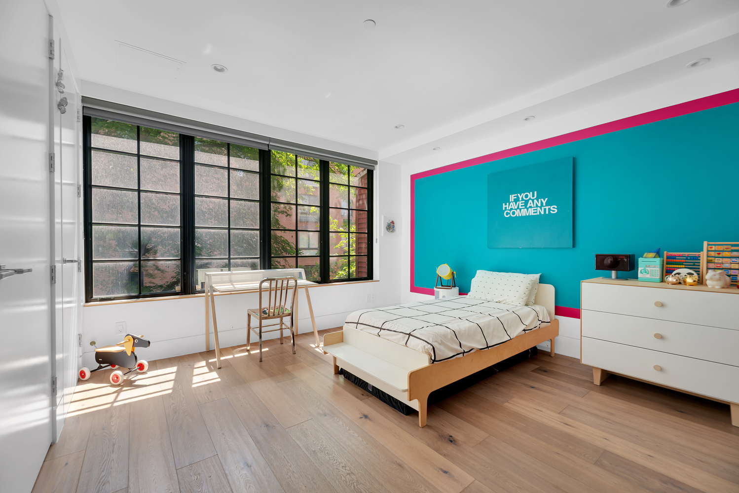 440 West 20th Street Manhattan, NY 10011 - Photo 11 of 35 a bedroom with a bed and a large window