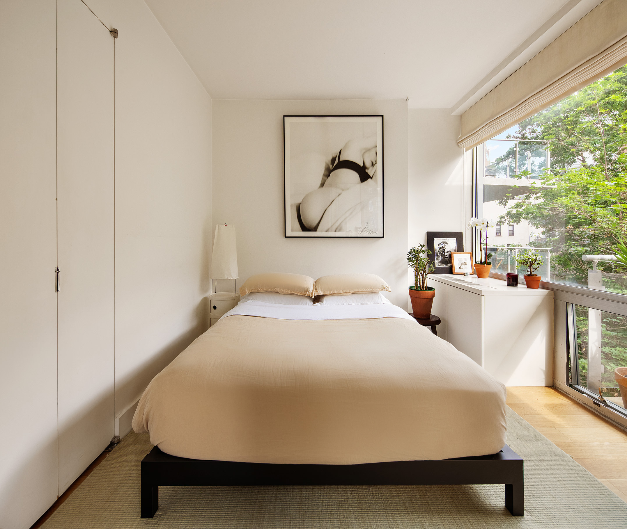 425 East 13th Street, Unit 3F Manhattan, NY 10009 - Photo 6 of 16 a bedroom with a bed and window