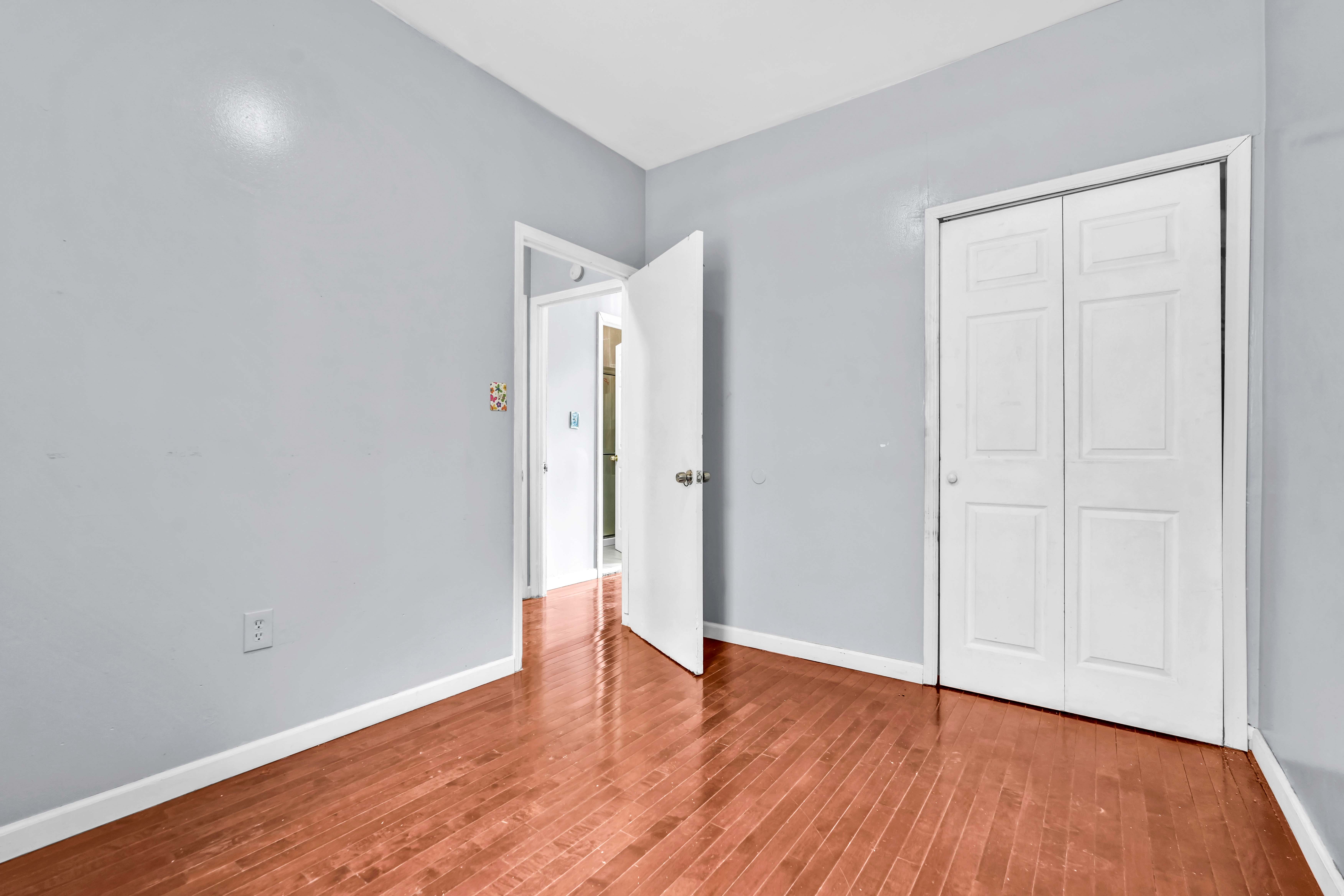 1633 St Johns Place, Unit 3 Brooklyn, NY 11233 - Photo 17 of 29 wooden floor in an empty room