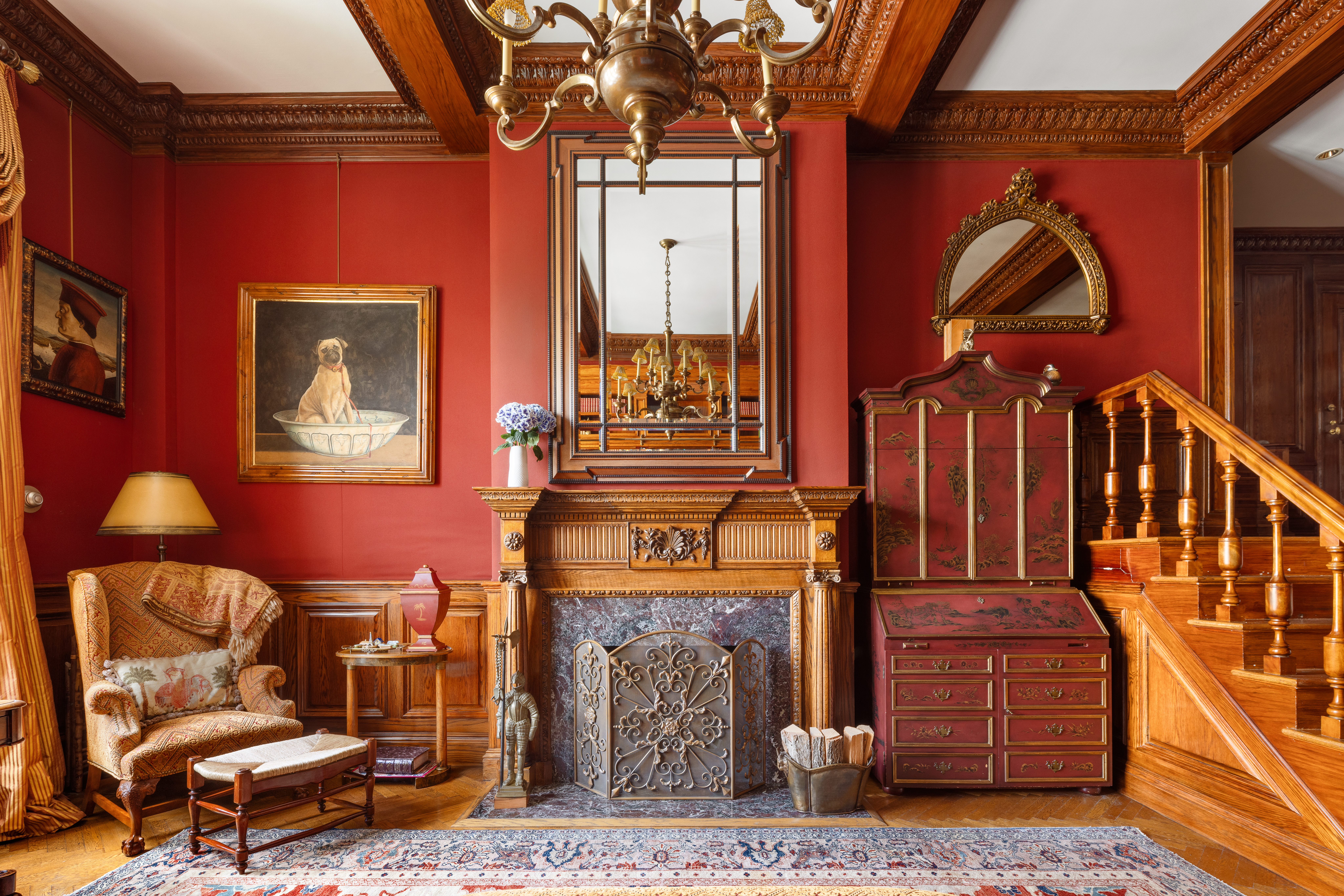 14 East 75th Street, Unit 10C Manhattan, NY 10021 - Photo 13 of 16 a living room with furniture a lamp and a fireplace
