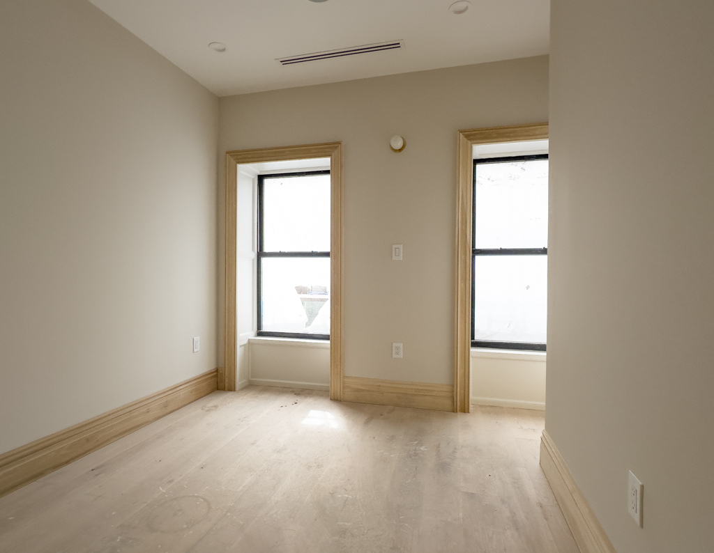 795 Quincy Street Brooklyn, NY 11221 - Photo 12 of 17 an empty room with windows