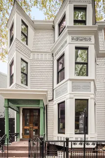 a view of a brick building with large windows