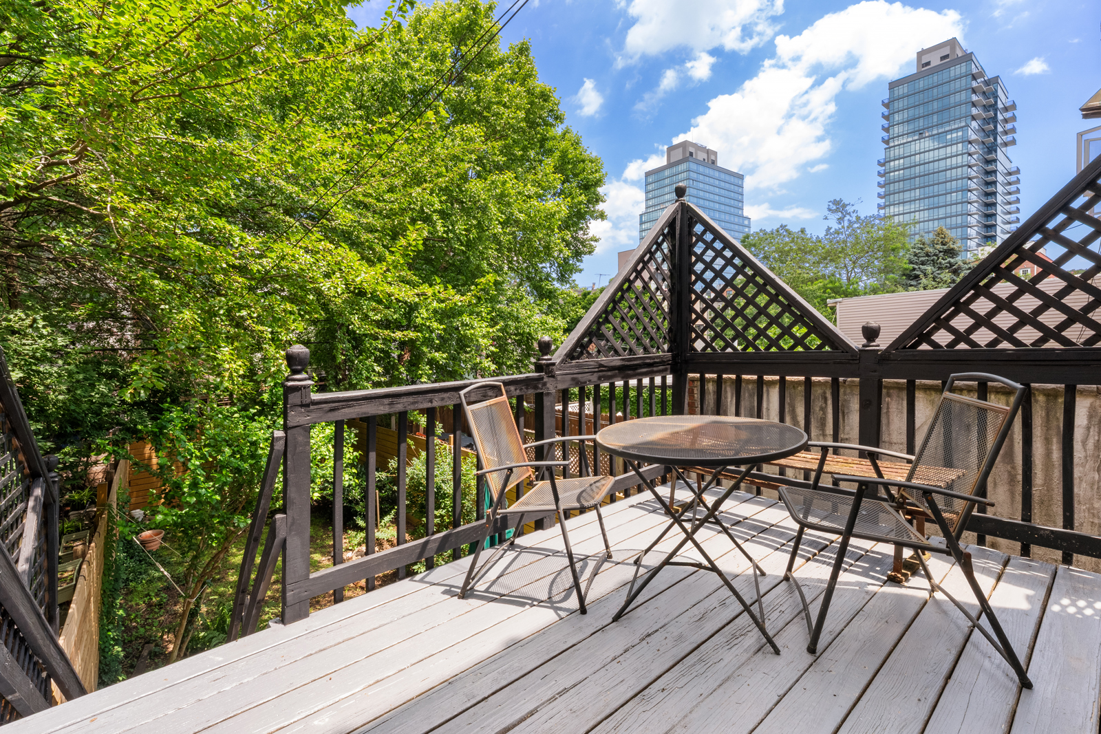 441 Union Street, Unit 2 Brooklyn, NY 11231 - Photo 7 of 11 a view of a roof deck with table and chairs and wooden floor