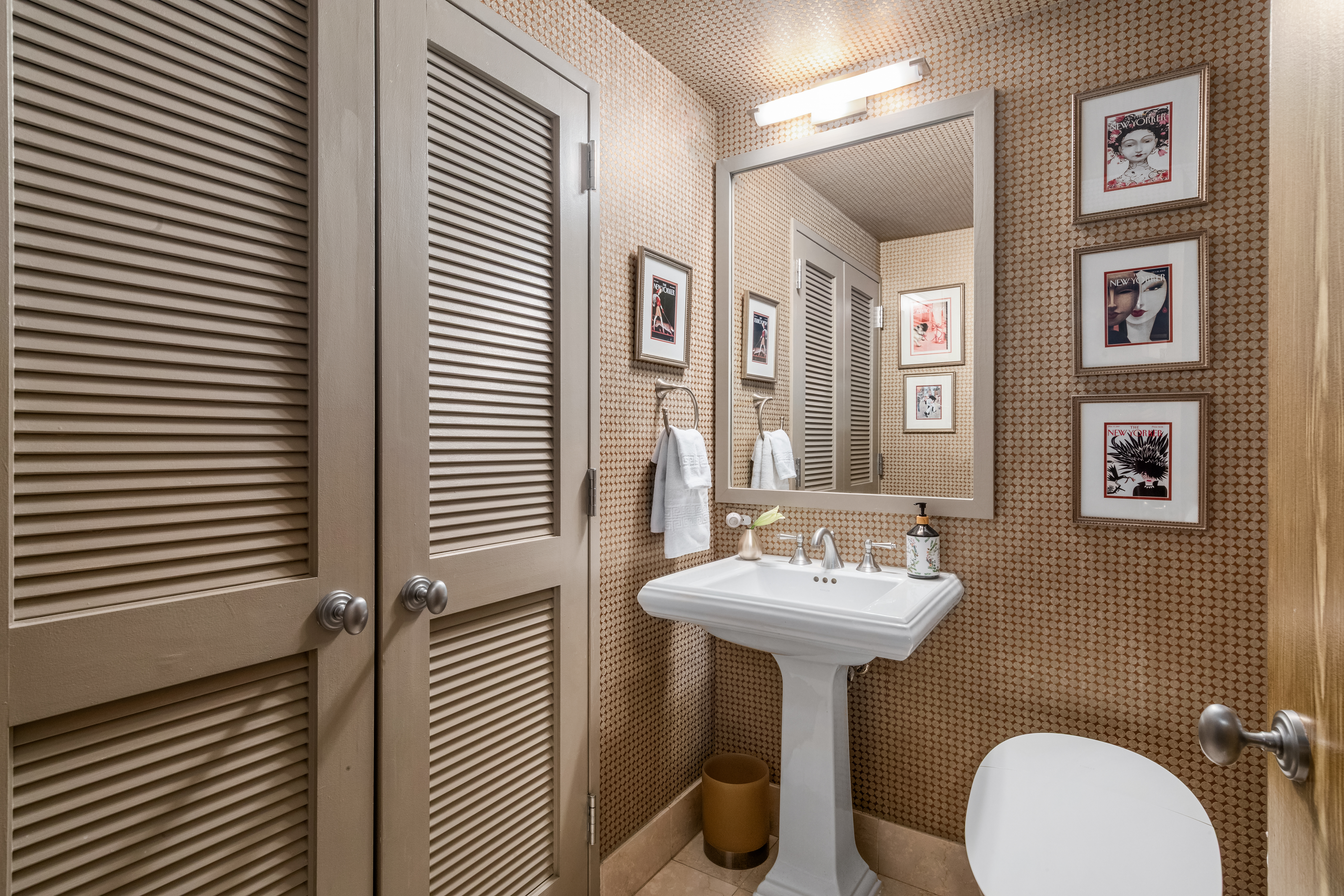 1760 2nd Avenue, Unit 2B Manhattan, NY 10128 - Photo 8 of 13 a bathroom with a sink a mirror and a toilet