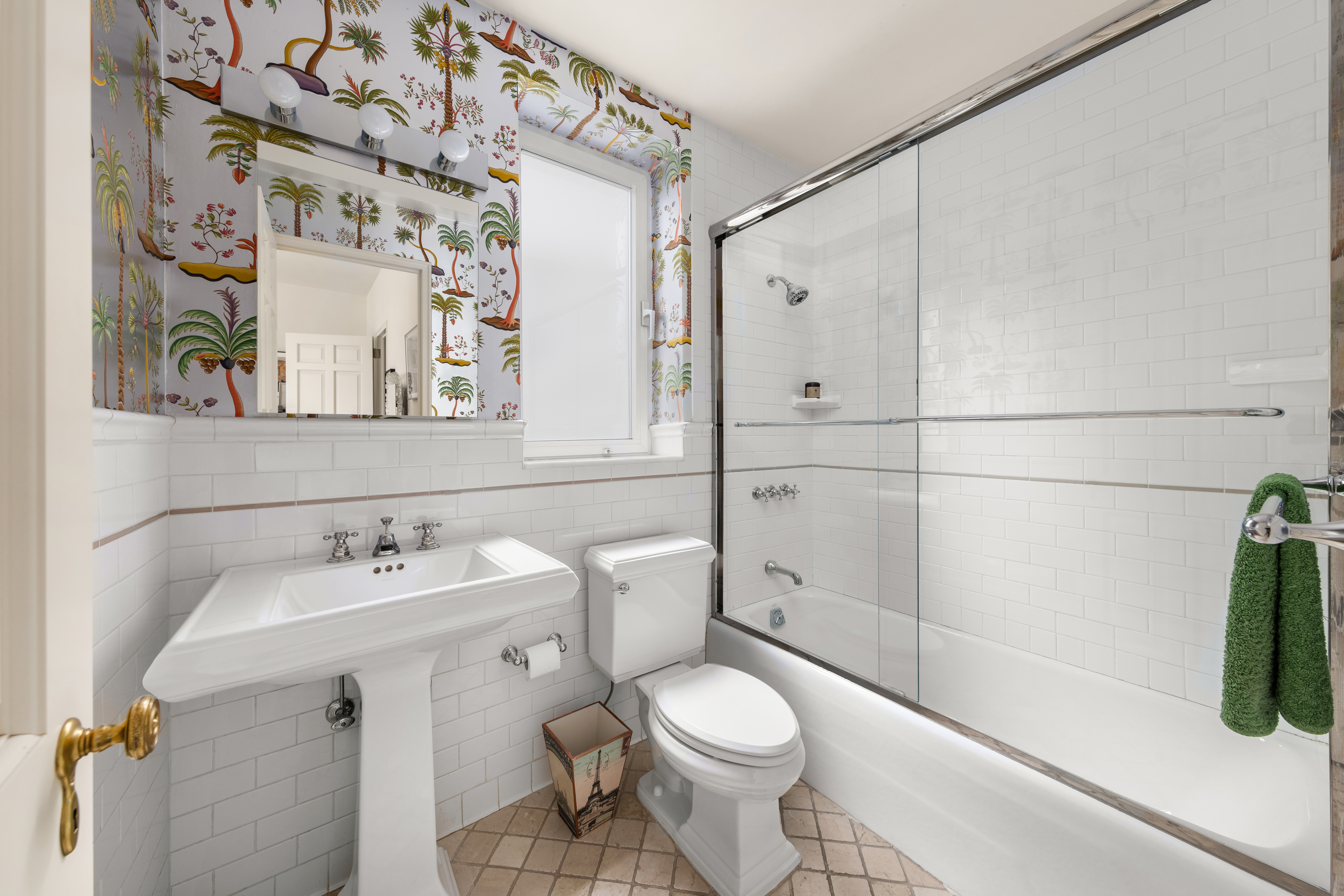 1 East 66th Street, Unit 9EF Manhattan, NY 10065 - Photo 17 of 19 a white toilet sitting next to a bathroom sink