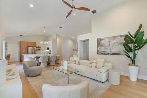 a living room with patio bathtub and a chandelier