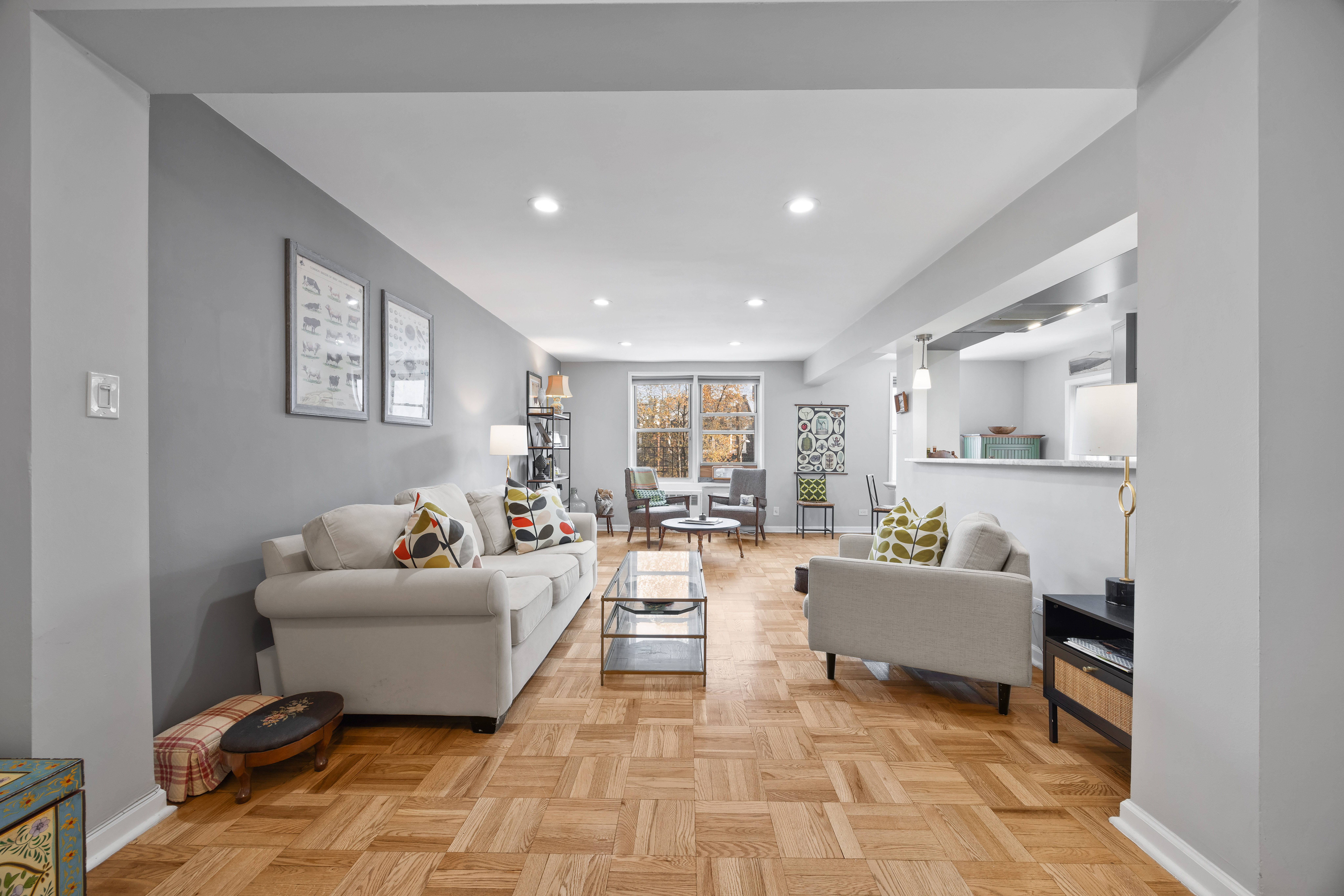 255 Fieldston Terrace, Unit 2L Bronx, NY 10471 - Photo 3 of 32 a living room with furniture and a rug