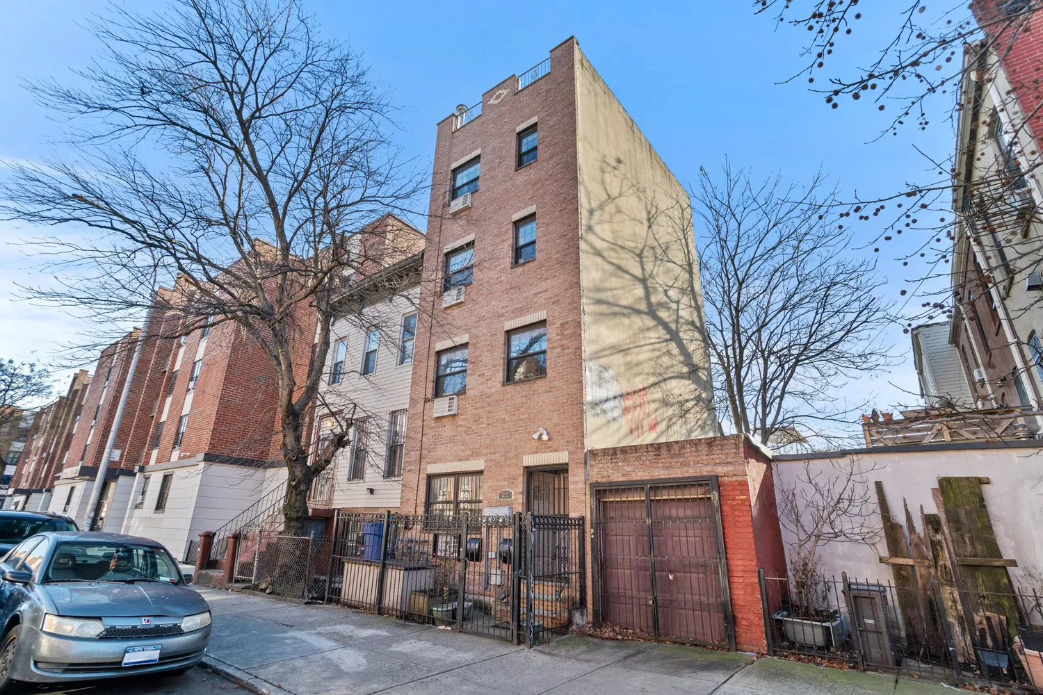 a view of a building with a snow in the yard