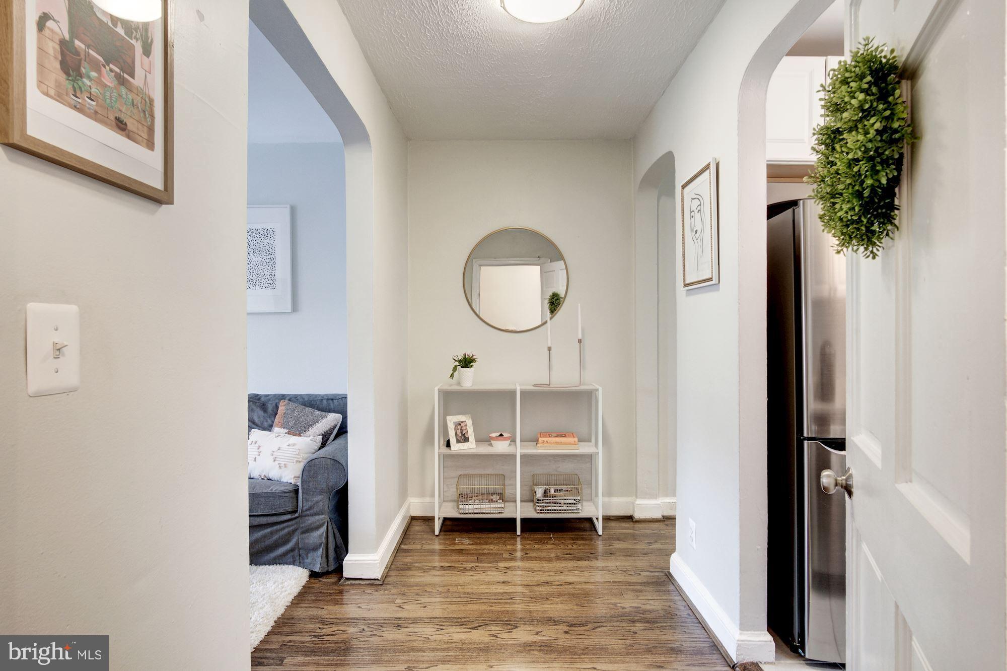 731 13th Street Northeast Washington, DC 20002 - Photo 5 of 43 a bedroom with a bed and a potted plant