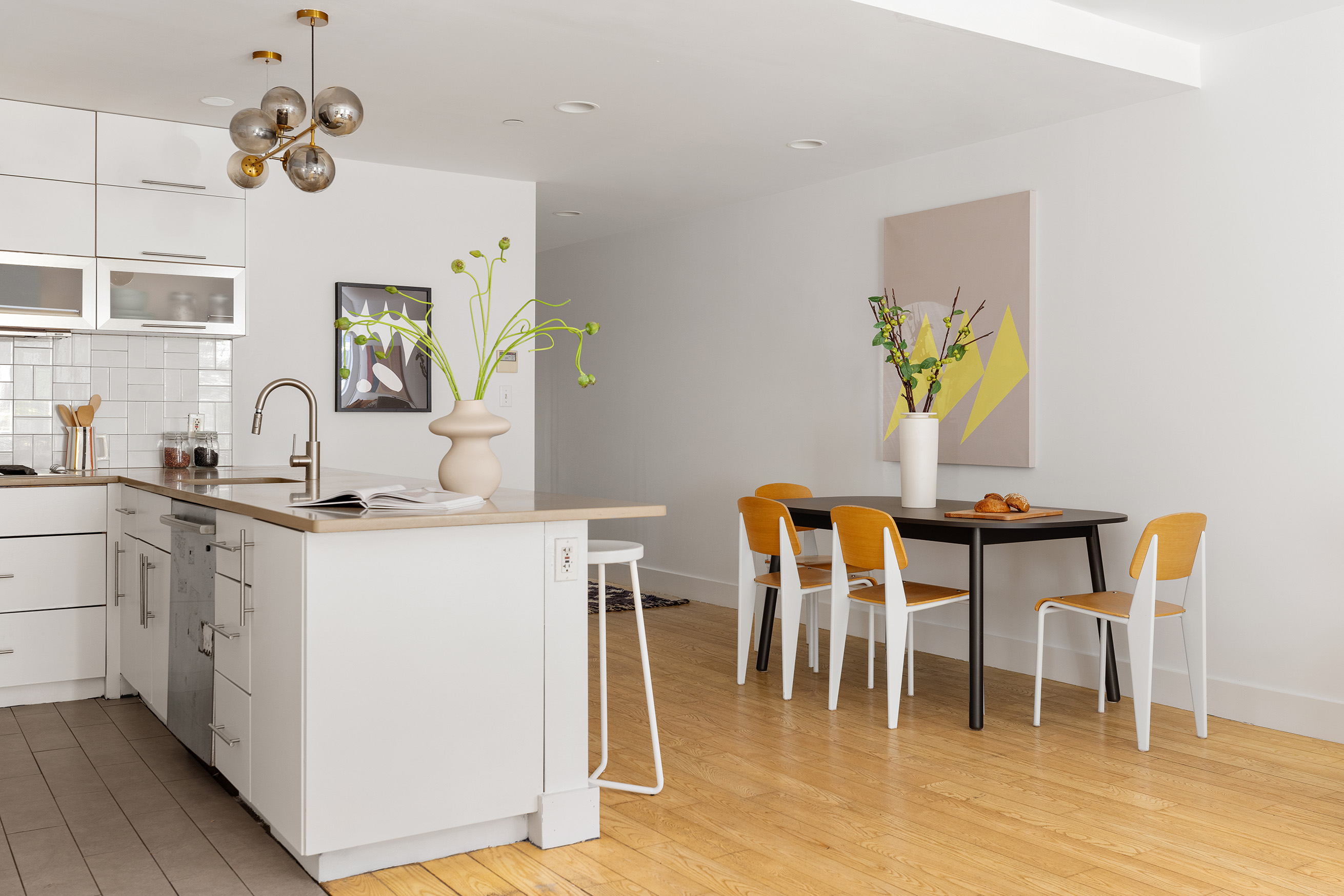 321 Union Street, Unit 1B Brooklyn, NY 11231 - Photo 6 of 10 a kitchen with a dining table chairs and chandelier