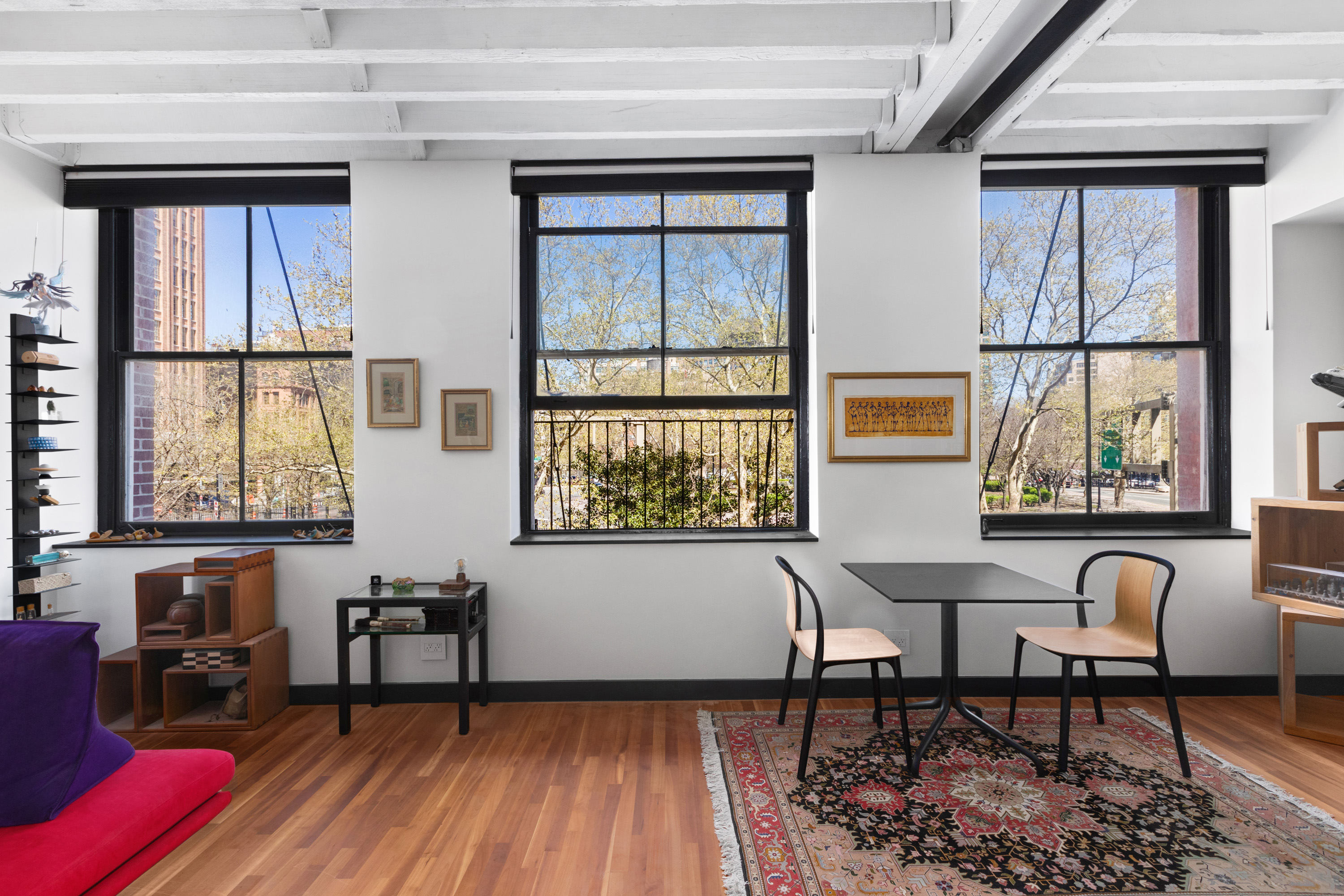 39 North Moore Street, Unit 2A Manhattan, NY 10013 - Photo 16 of 17 a living room with furniture and a window