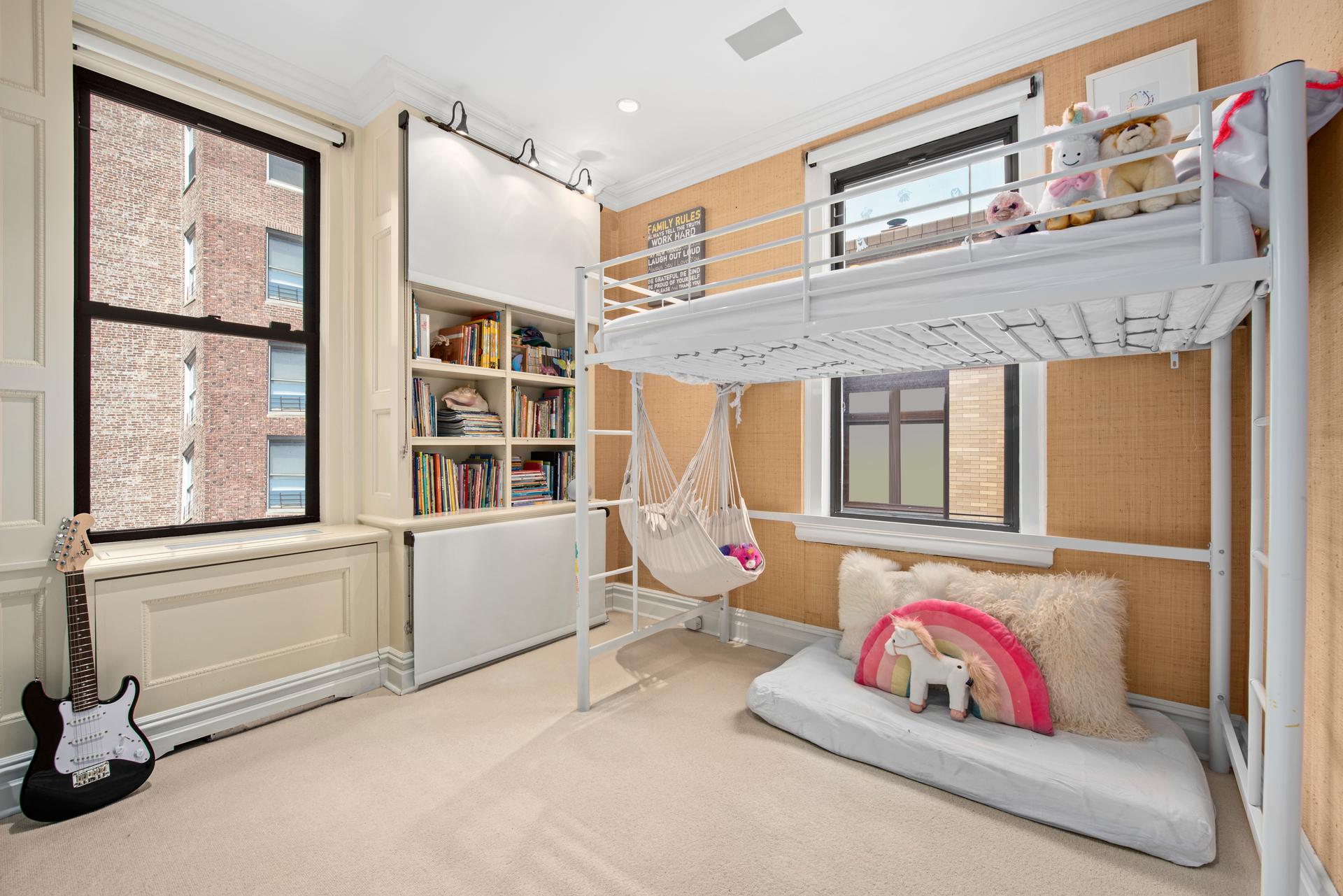 1140 5th Avenue, Unit 8C Manhattan, NY 10128 - Photo 12 of 16 a living room with furniture and a window