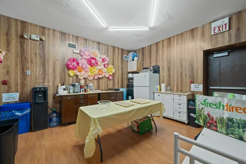 a view of a dining room with furniture window and outdoor kitchen