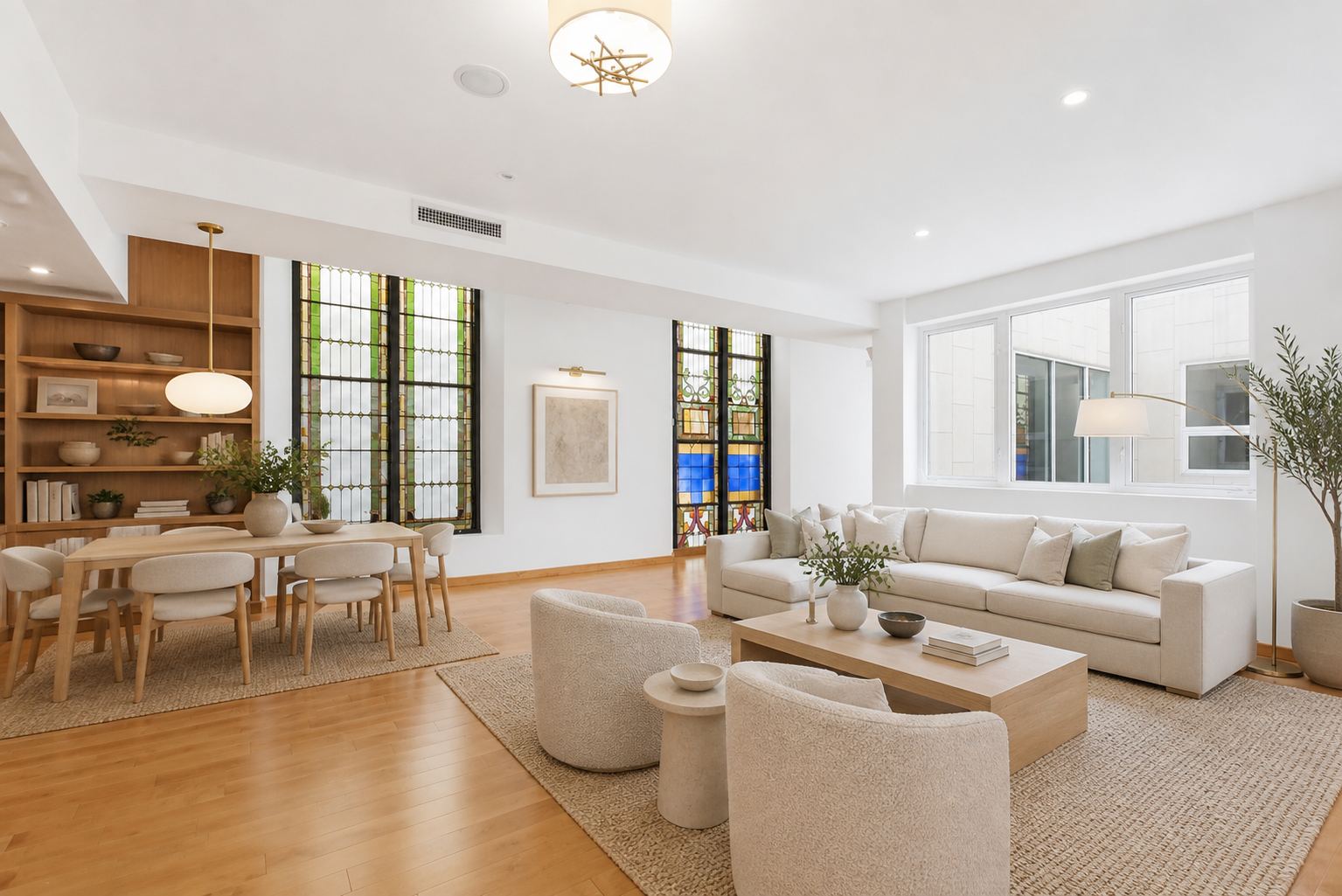 135 West 4th Street, Unit 3W Manhattan, NY 10012 - Photo 3 of 24 a living room with furniture and a large window
