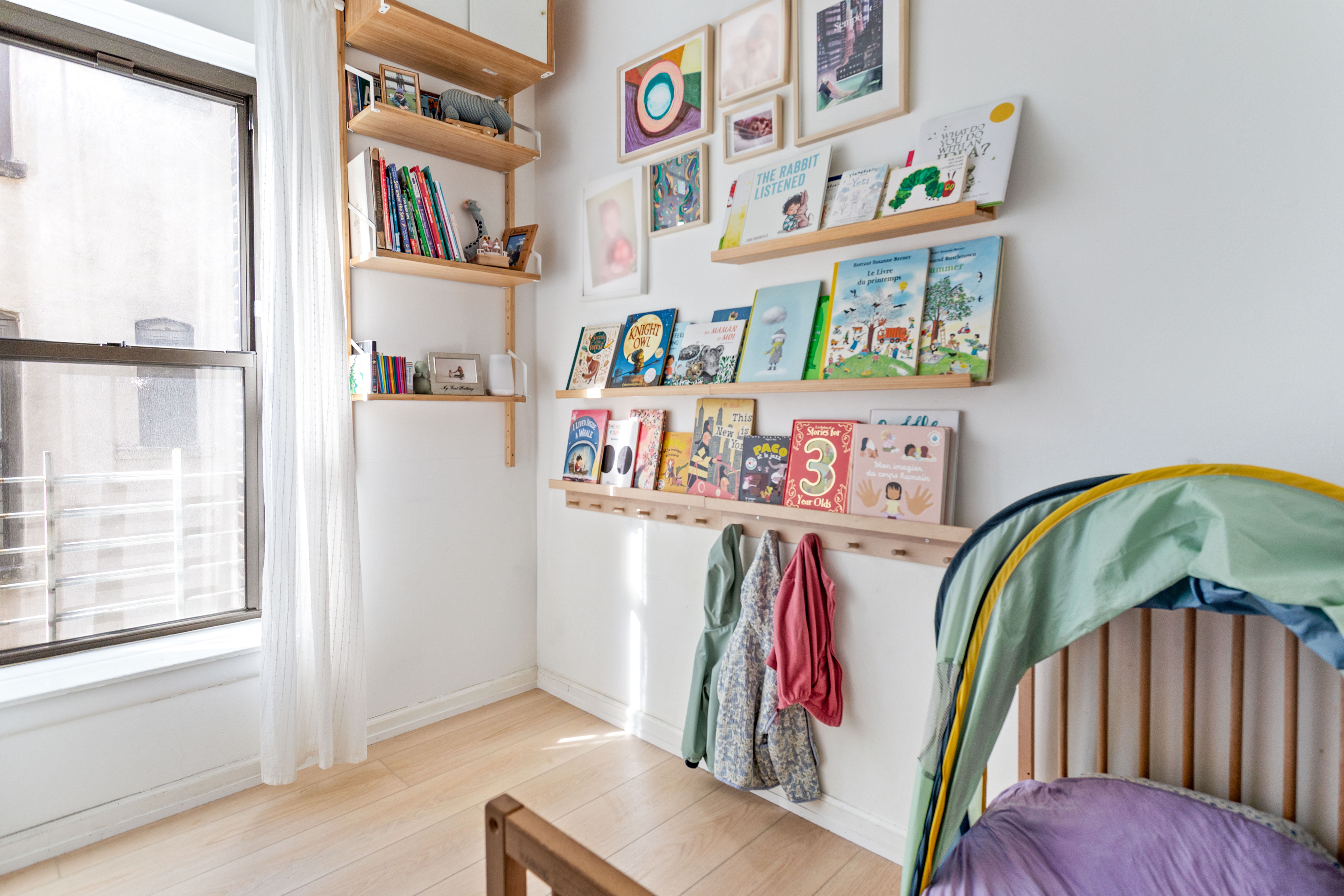 218 Scholes Street, Unit 12 Brooklyn, NY 11206 - Photo 5 of 8 a view of walk in closet with clothes and shoes