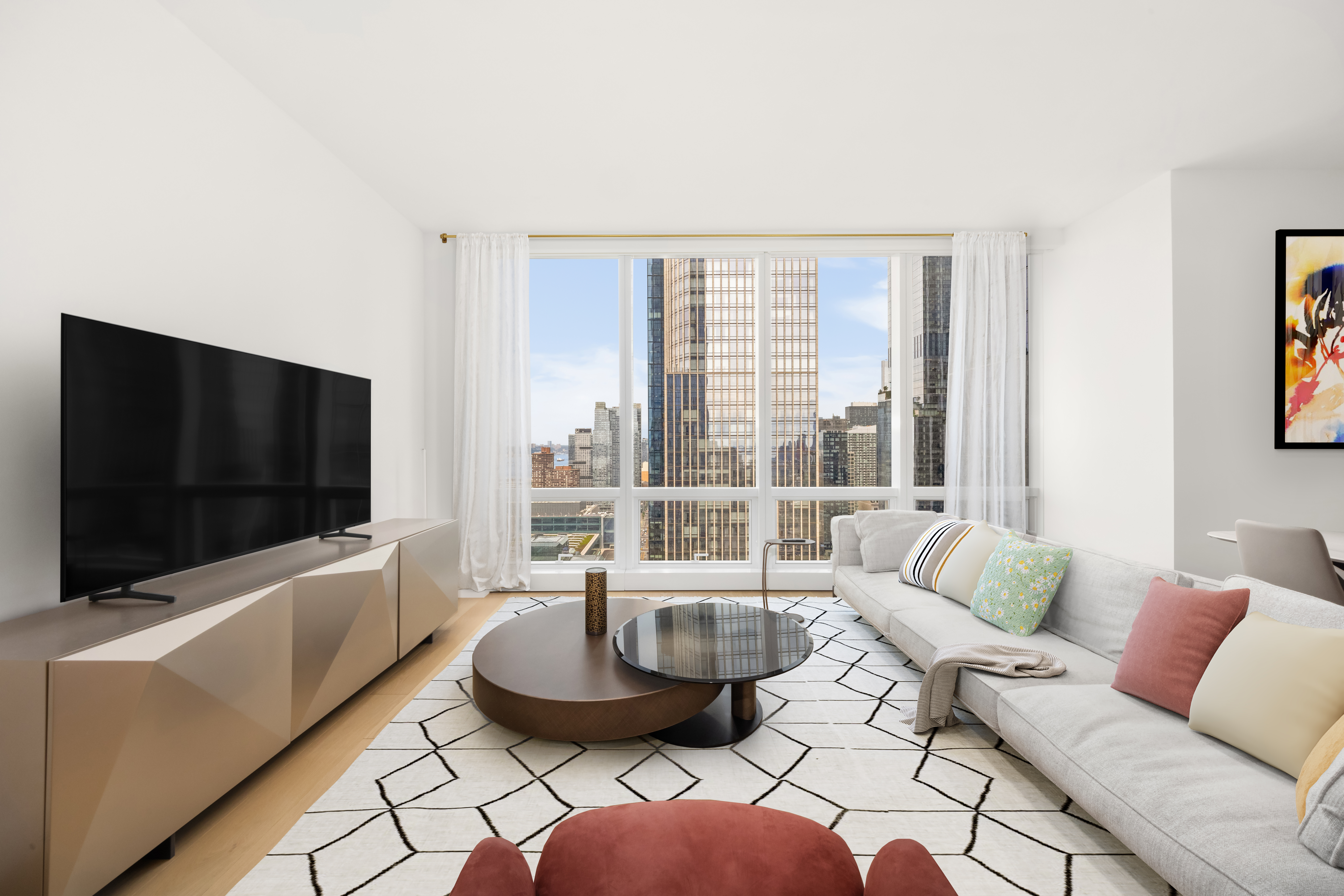 15 Hudson Yards, Unit 37G Manhattan, NY 10001 - Photo 2 of 24 a living room with furniture and a flat screen tv