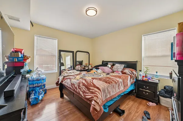 a bedroom with a bed and a dresser