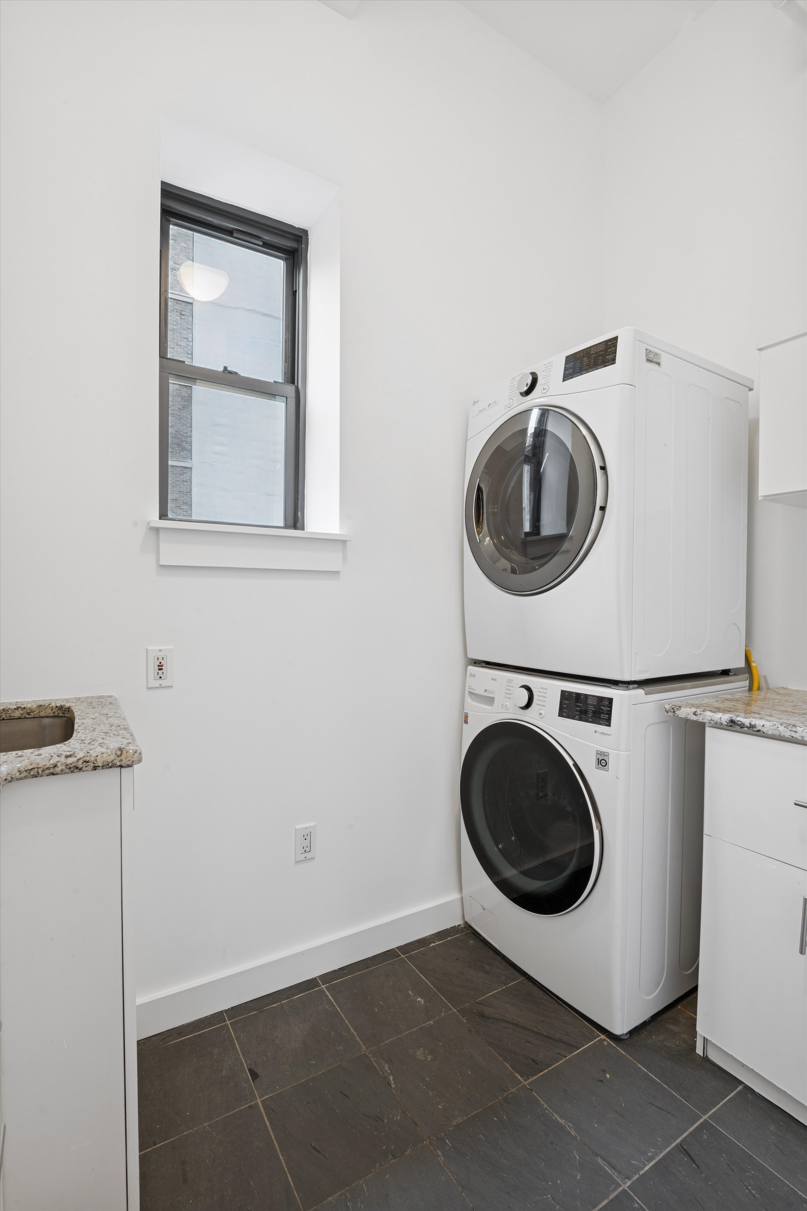 109 West 26th Street, Unit 9 Manhattan, NY 10001 - Photo 22 of 23 a utility room with dryer and washer