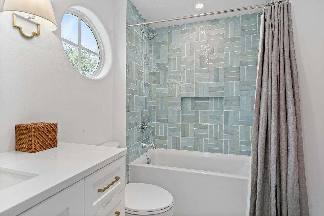 1182 Canoe Point Delray Beach, FL 33444 - Photo 25 of 46 a bathroom with a shower a bathtub and a toilet