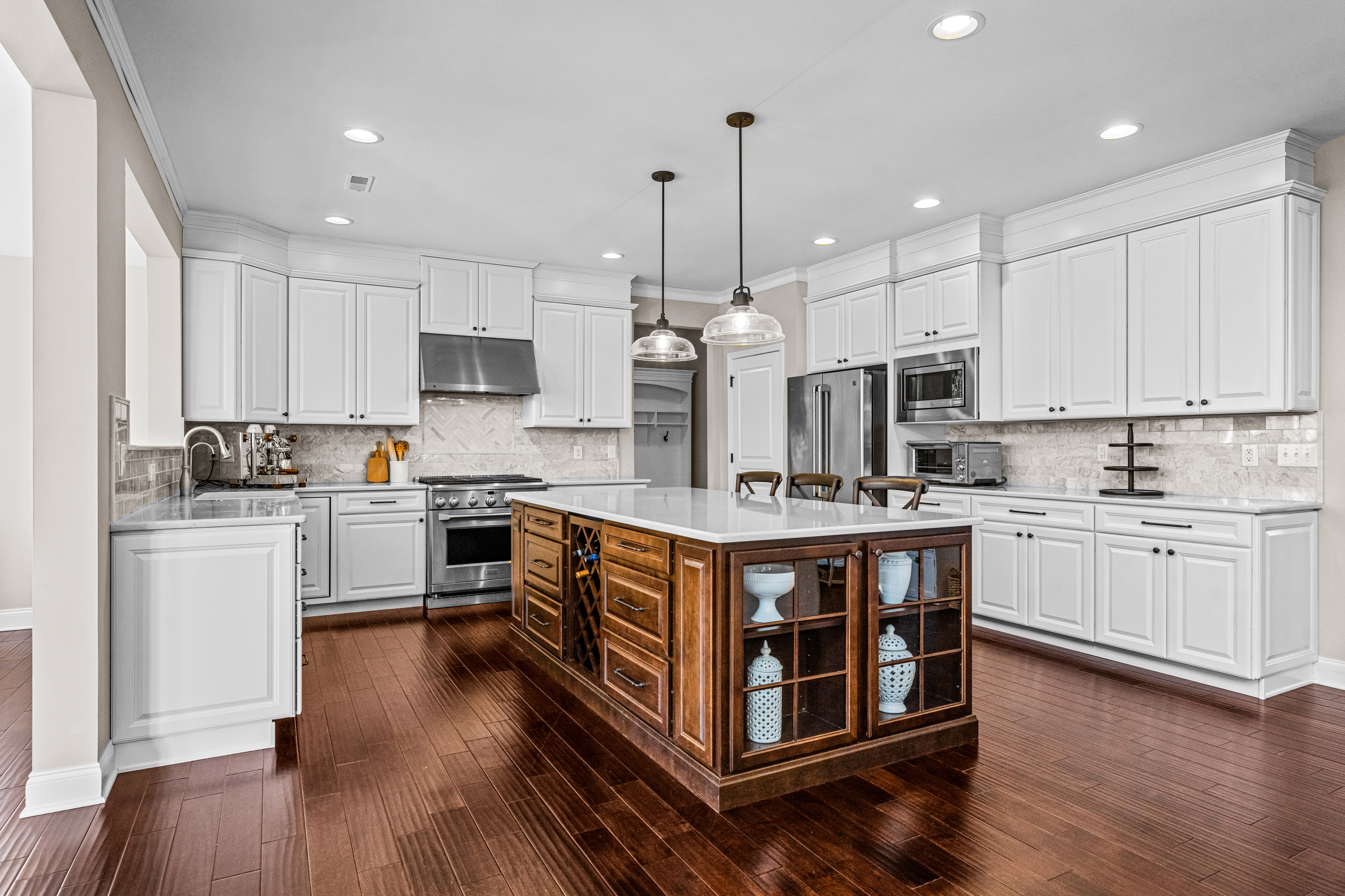 52 Wellesley Way Marlton, NJ 08053 - Photo 46 of 98 a kitchen with stainless steel appliances granite countertop a stove a sink dishwasher a refrigerator and white cabinets with wooden floor