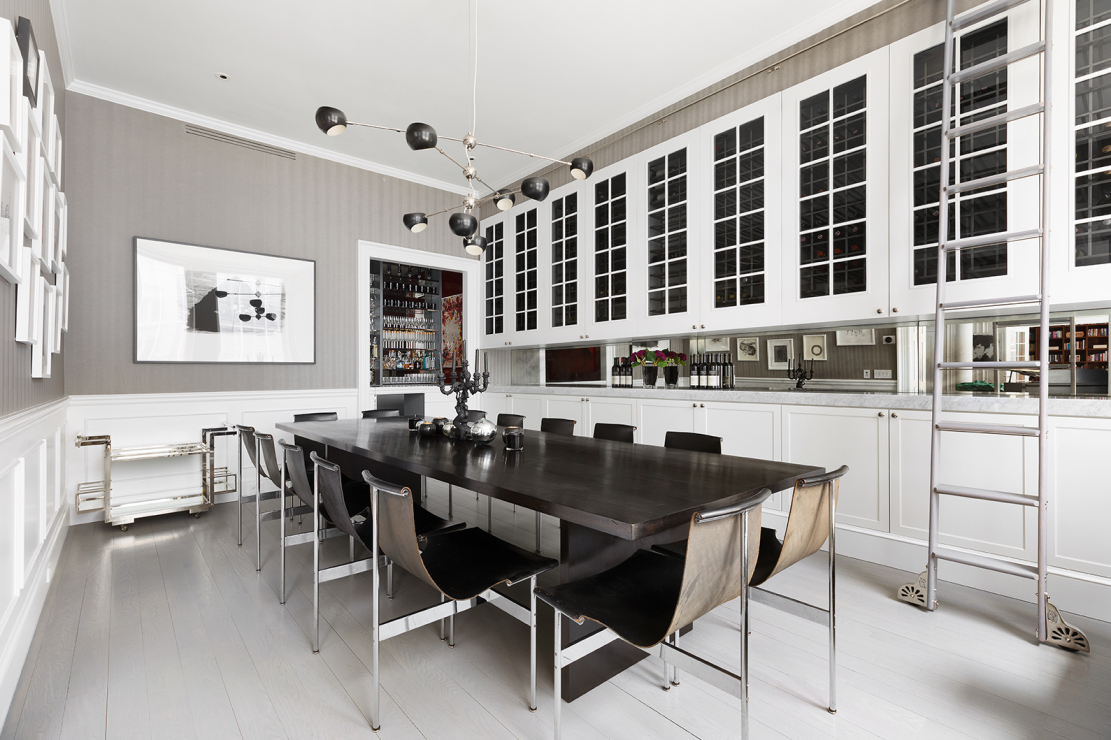 114 Liberty Street, Unit 4 Manhattan, NY 10006 - Photo 6 of 13 a view of a dining room with furniture and chandelier