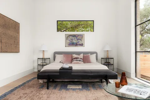 a living room with furniture and a sink