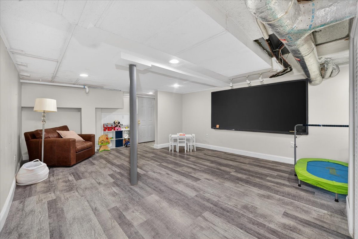 6 Studley Road Hingham, MA 02043 - Photo 20 of 27 a living room with furniture and a flat screen tv