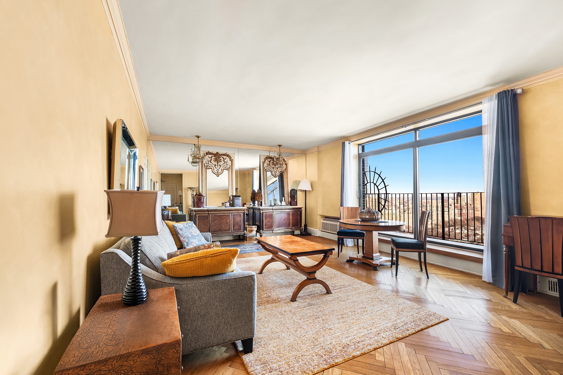 150 Central Park South, Unit 3201 Manhattan, NY 10019 - Photo 2 of 7 a living room with furniture and a wooden floor