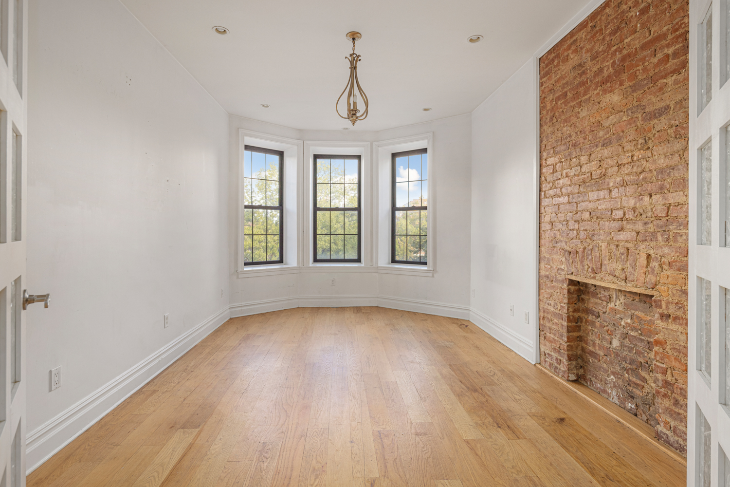 912 Eastern Parkway, Unit 1 Brooklyn, NY 11213 - Photo 6 of 11 a view of livingroom with hardwood floor and window