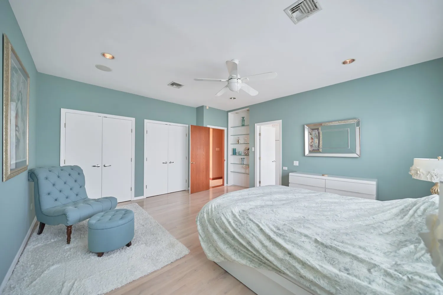 a bathroom with a double vanity sink toilet mirror and bathtub