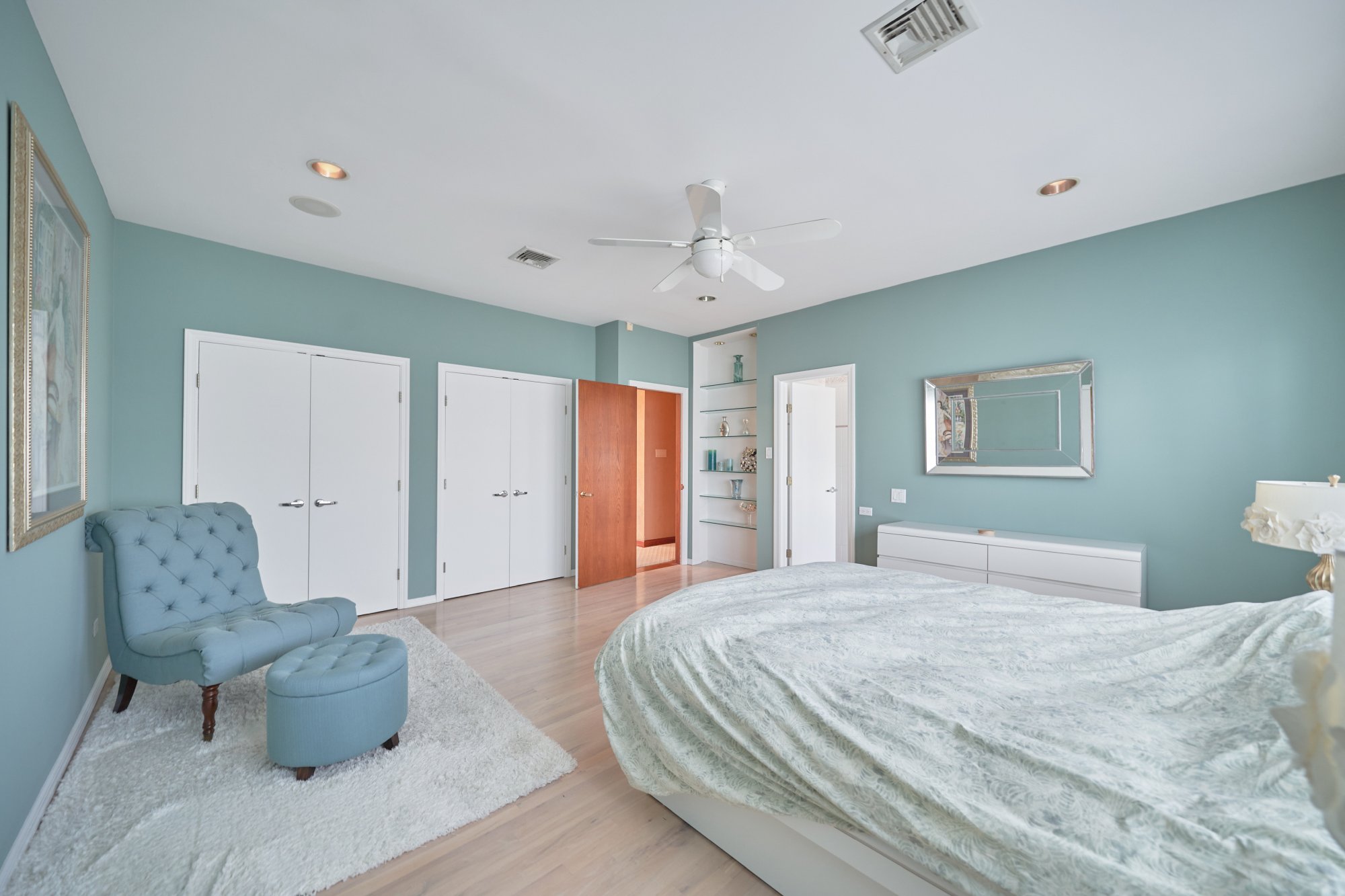 3411 Country Club Road Bronx, NY 10465 - Photo 28 of 54 a spacious bedroom with a bed and a couch