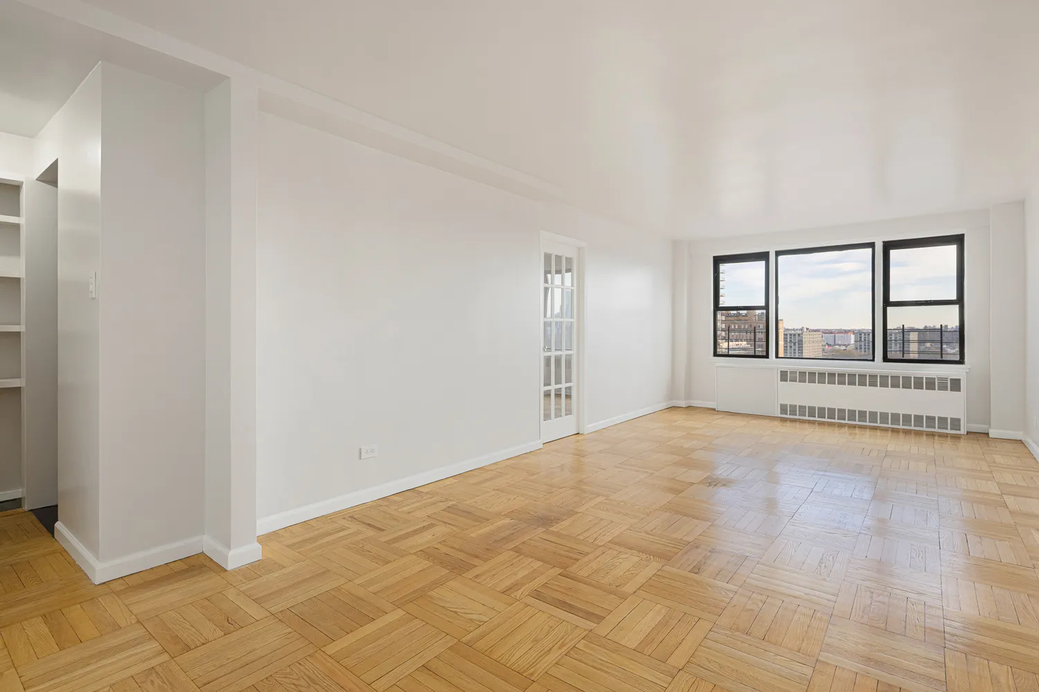 a view of an empty room with a window