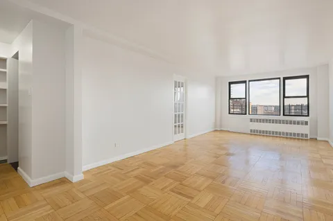 a view of an empty room with a window