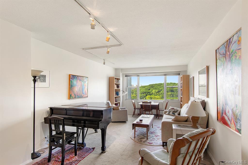 2400 Johnson Avenue, Unit 3B Bronx, NY 10463 - Photo 4 of 28 a living room with furniture and large windows