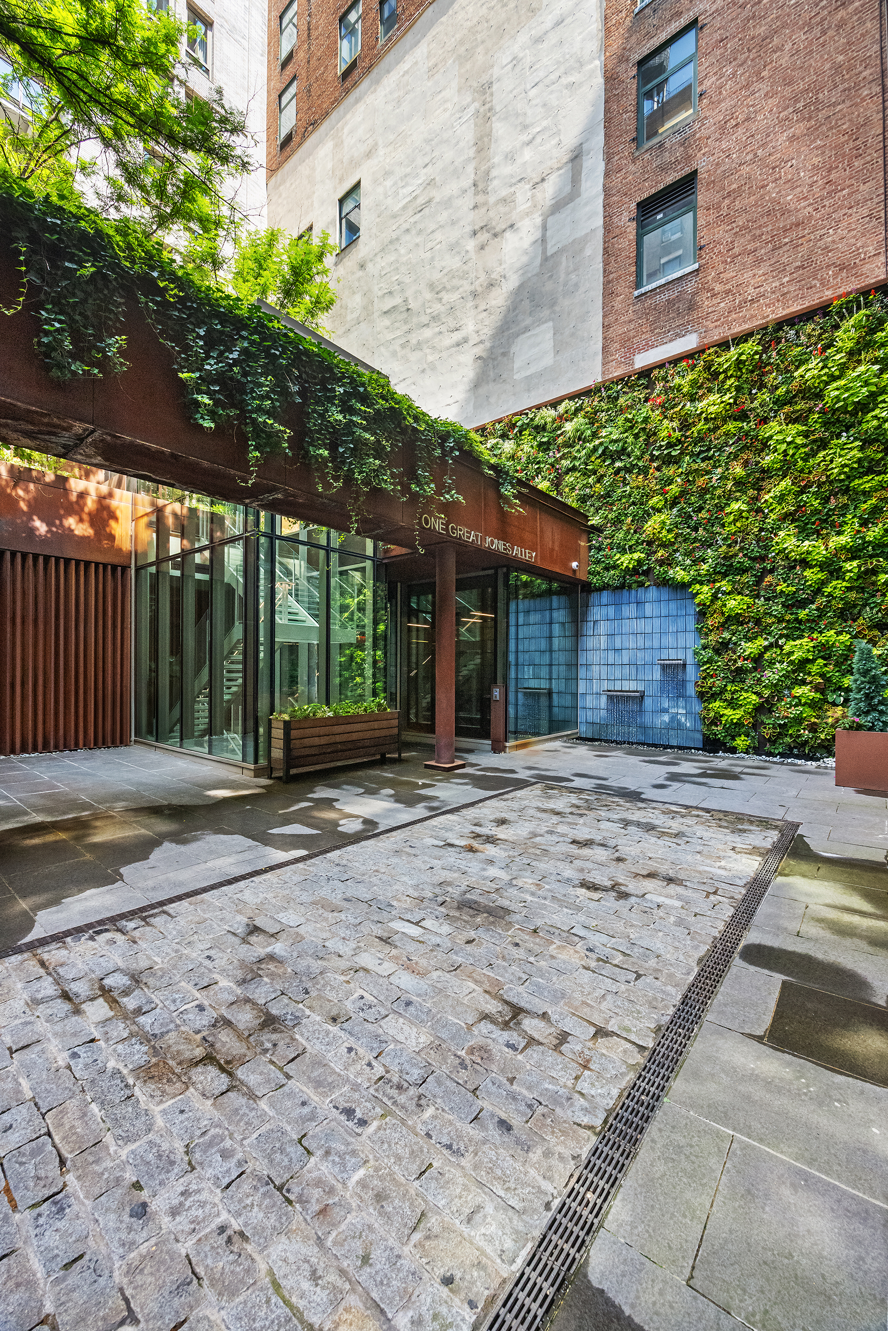 1 Great Jones Alley, Unit 10 Manhattan, NY 10012 - Photo 30 of 41 a view of a house with a tree
