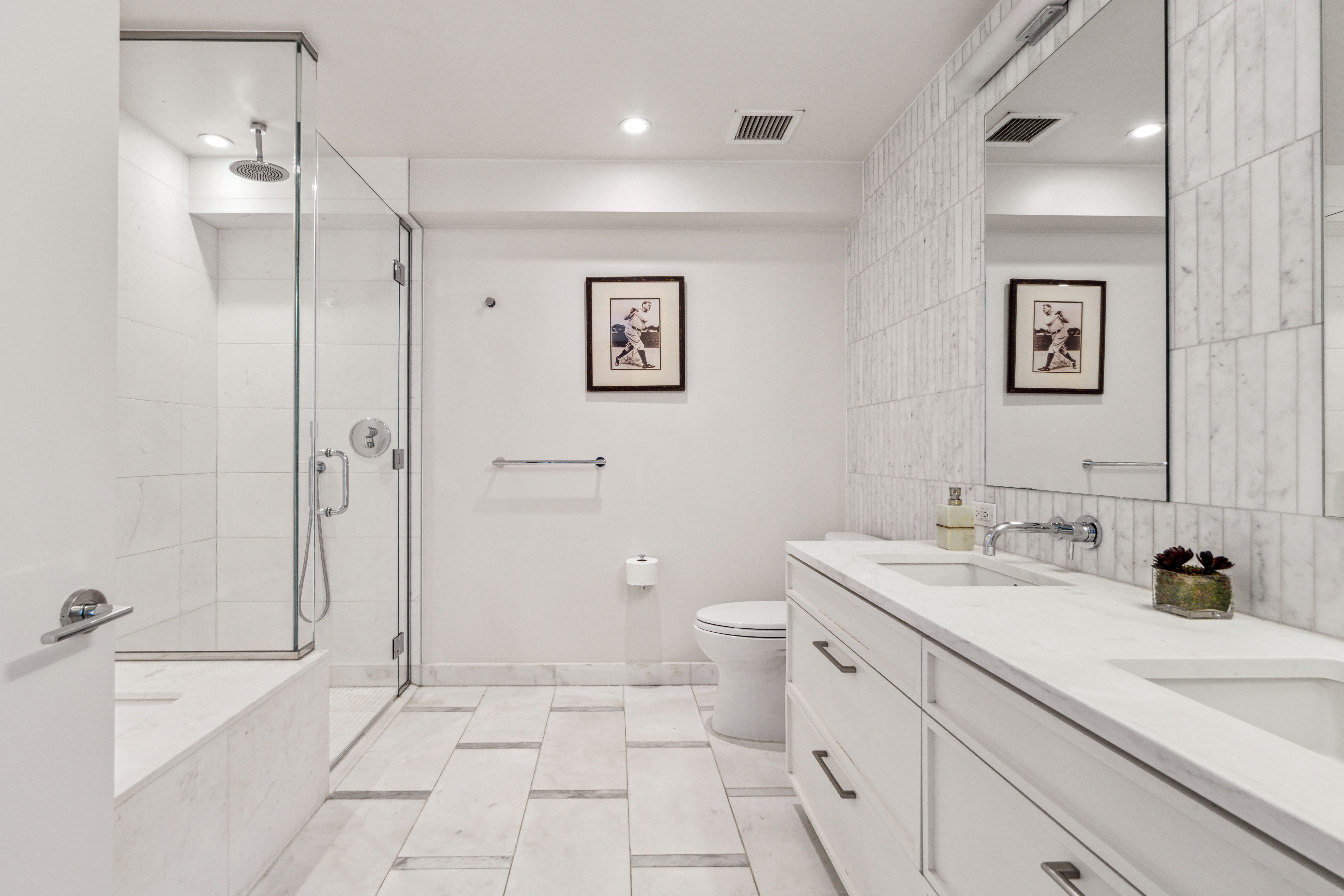 160 East 22nd Street, Unit 18C Manhattan, NY 10010 - Photo 8 of 12 a spacious bathroom with a sink a toilet and shower