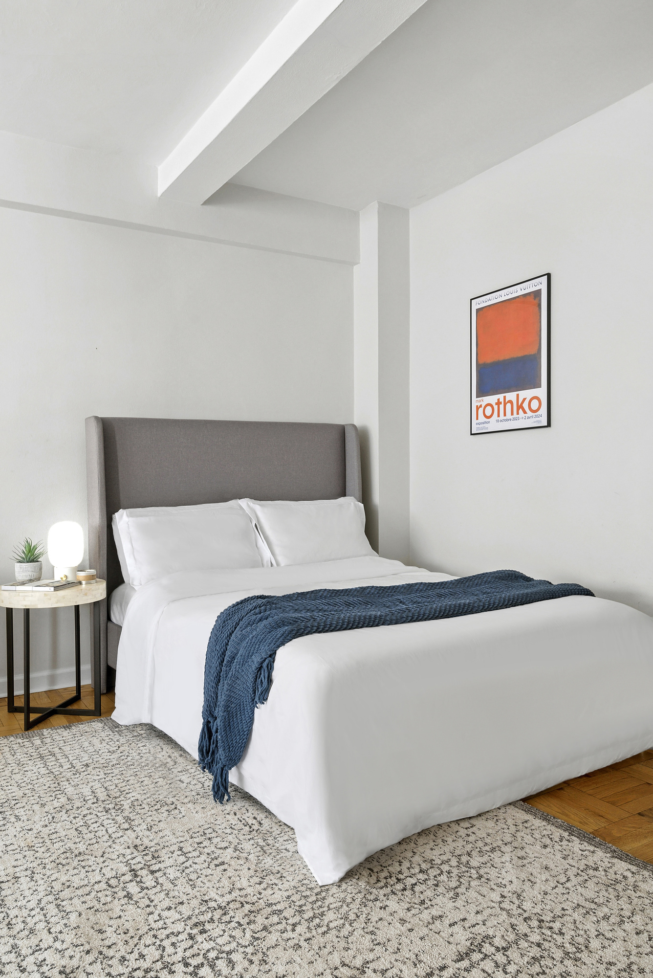 7 Lexington Avenue, Unit 12F Manhattan, NY 10010 - Photo 7 of 12 a bedroom with a bed and lamp