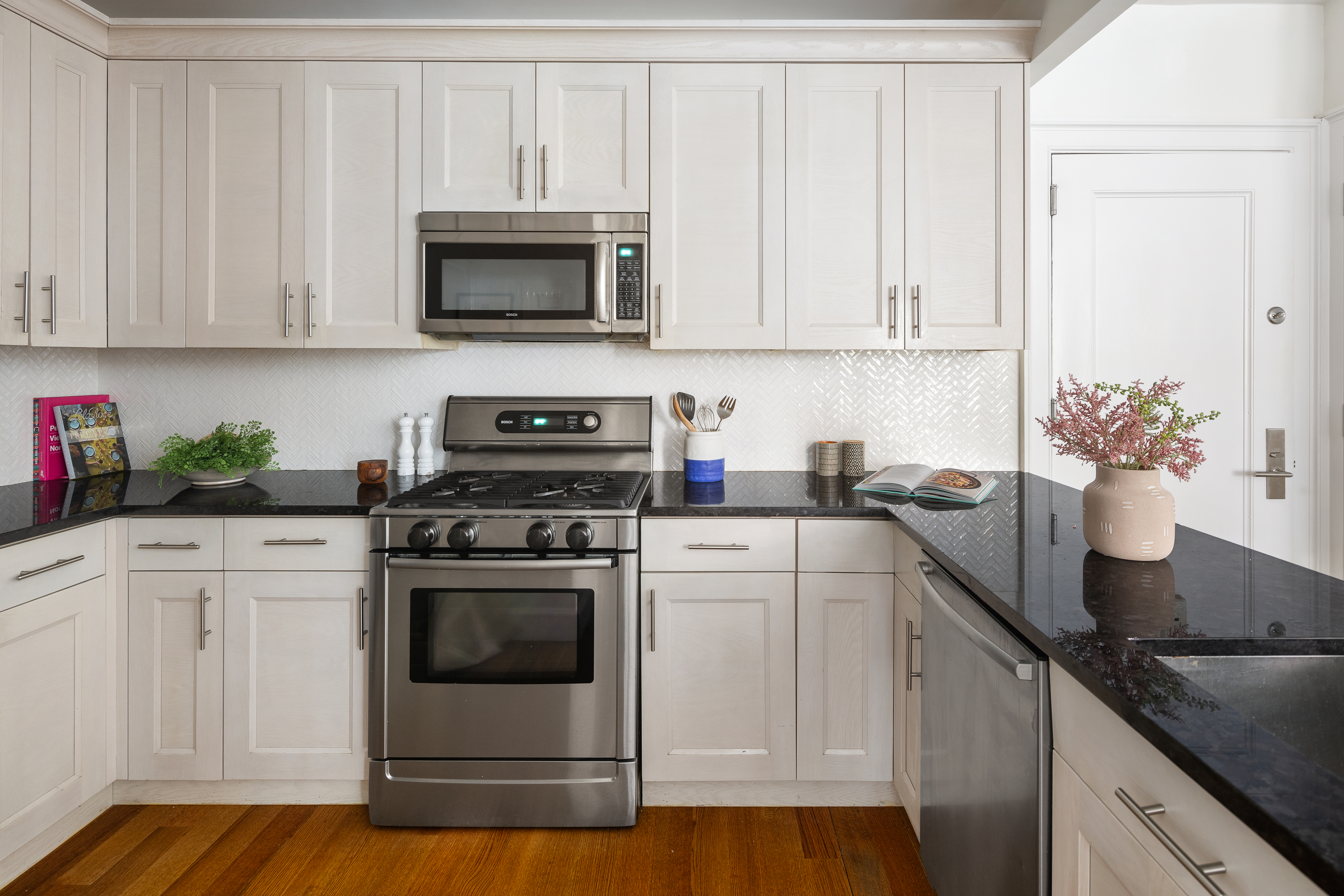 58 Strong Place, Unit 1D Brooklyn, NY 11231 - Photo 5 of 11 a kitchen with granite countertop white cabinets and white appliances