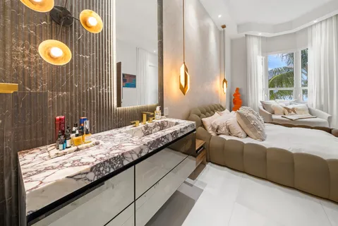 a bedroom with a bed and dresser