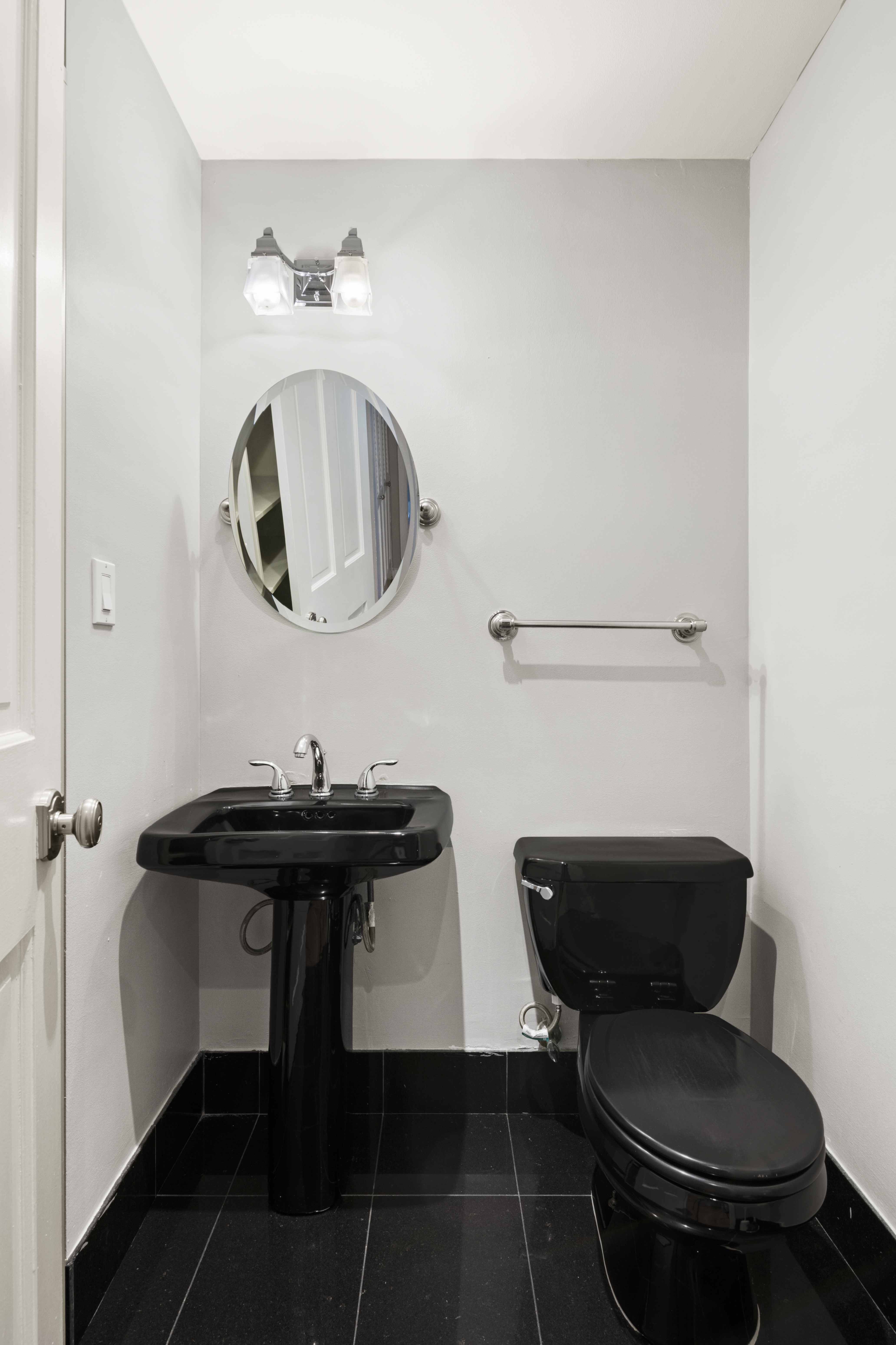 545 West End Avenue, Unit 7C Manhattan, NY 10024 - Photo 8 of 11 a bathroom with a toilet a sink and a mirror
