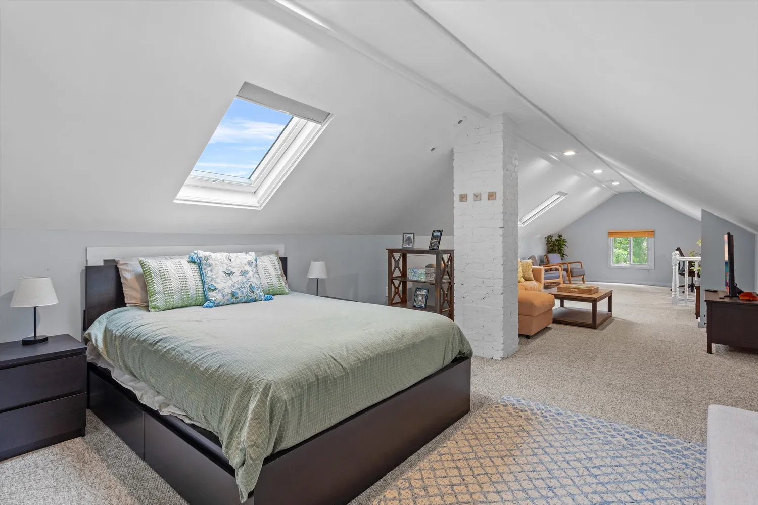 a patio with a table and chairs and potted plants
