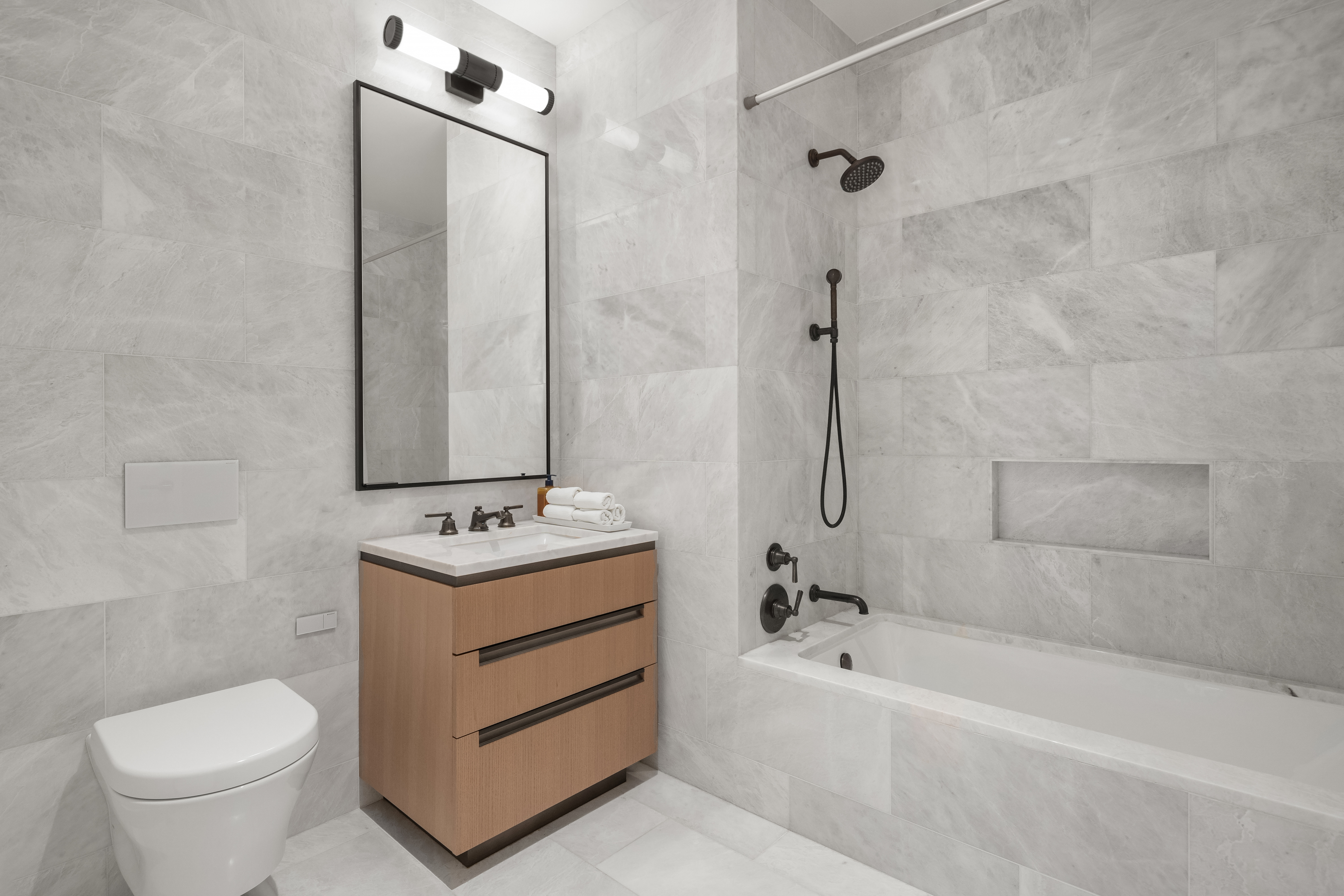 515 West 18th Street, Unit 210 Manhattan, NY 10011 - Photo 7 of 14 a bathroom with a sink toilet and shower