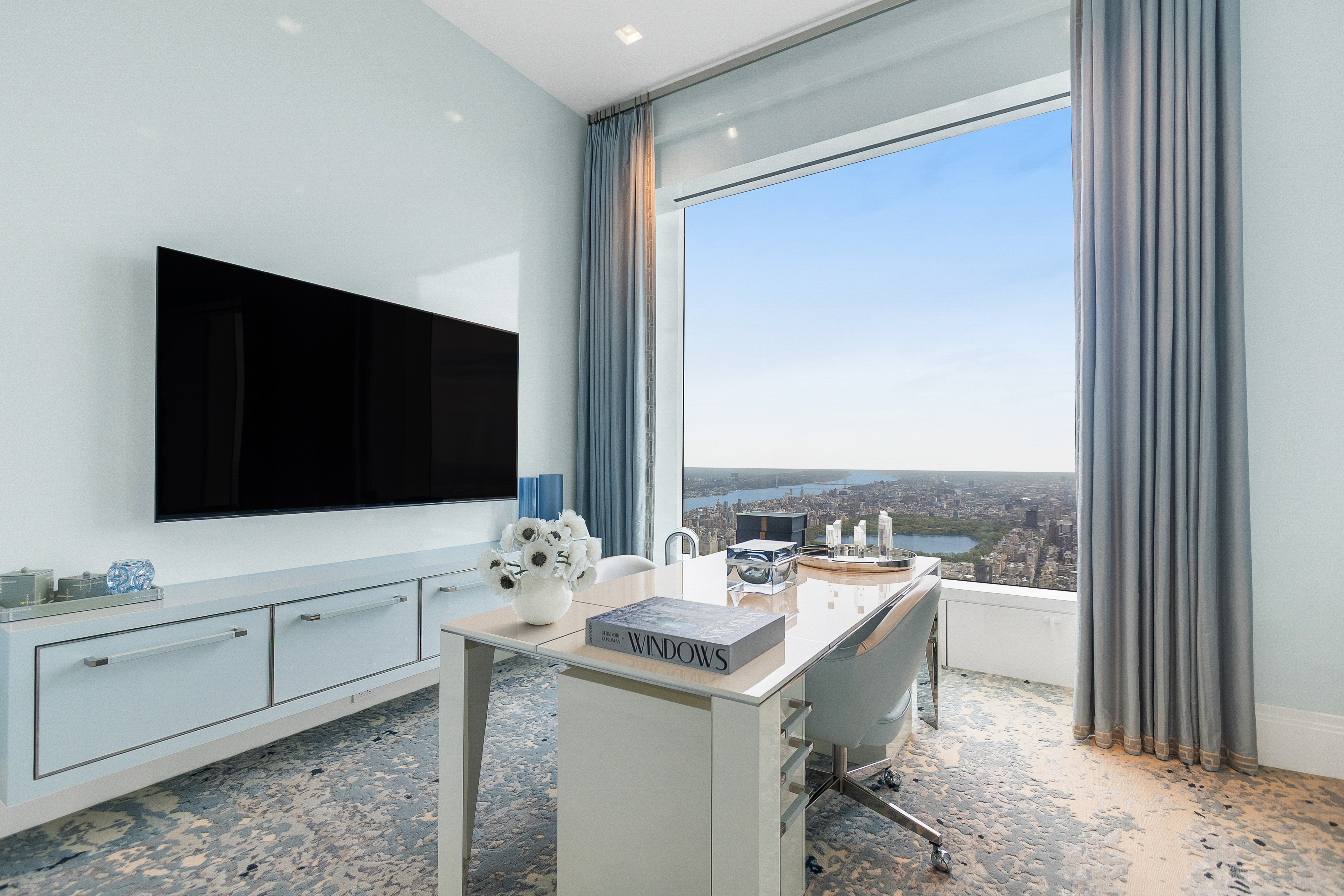 432 Park Avenue, Unit PH88 Manhattan, NY 10022 - Photo 8 of 17 a bathroom with a sink and a mirror