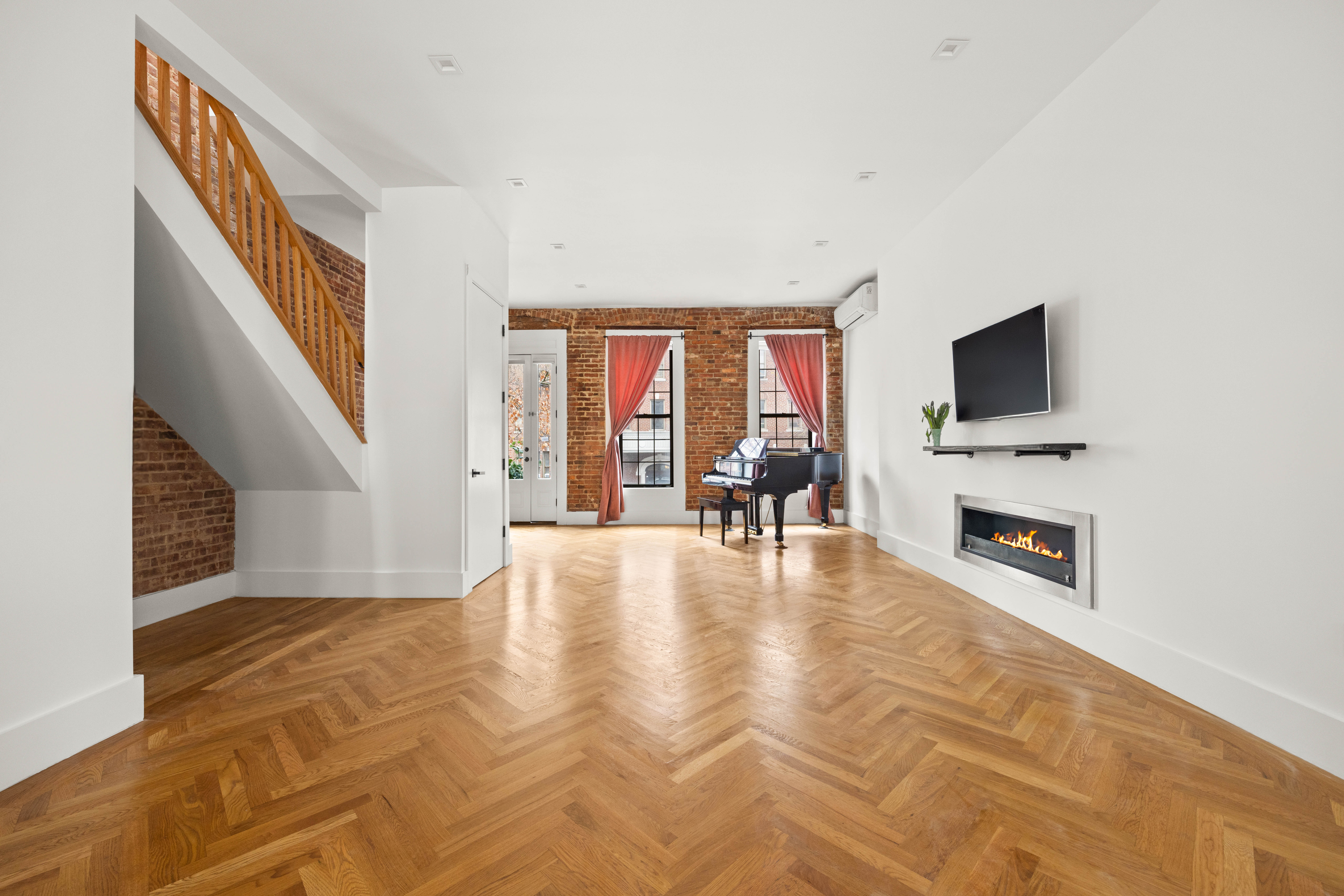 750 Lincoln Place Brooklyn, NY 11216 - Photo 3 of 24 a view of livingroom with furniture fireplace and windows