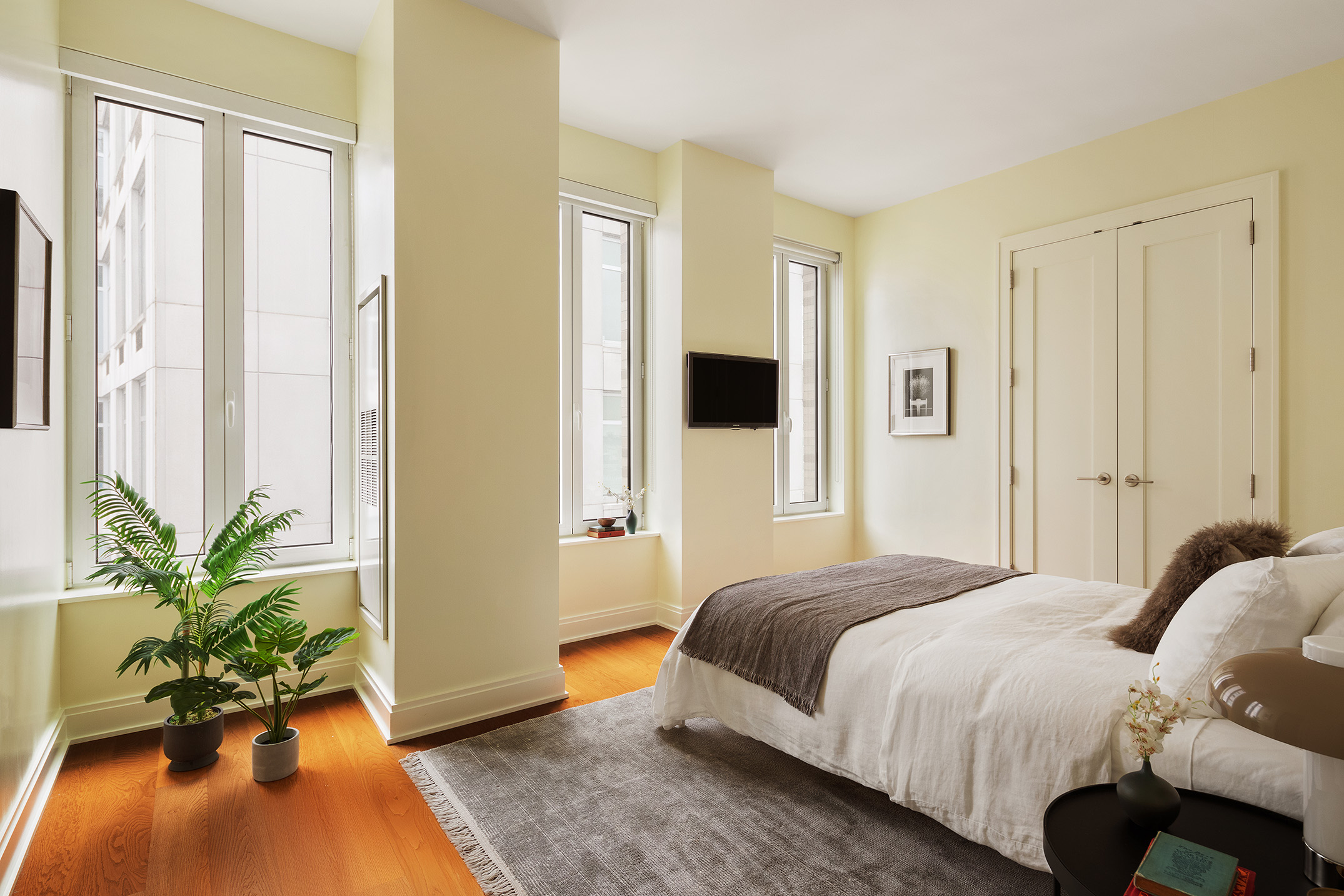 230 West 78th Street, Unit PH19 Manhattan, NY 10024 - Photo 15 of 17 a bedroom with a bed and a potted plant