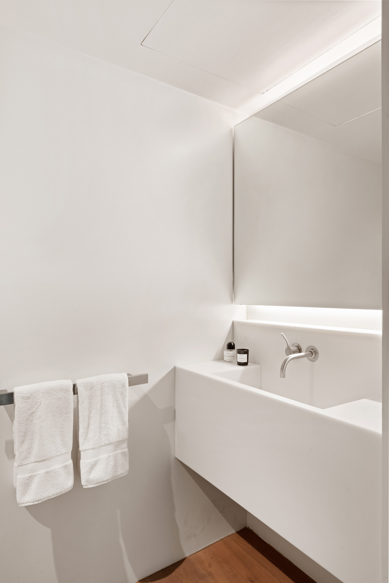 456 West 25th Street Manhattan, NY 10001 - Photo 6 of 22 a bathroom with a sink and a mirror