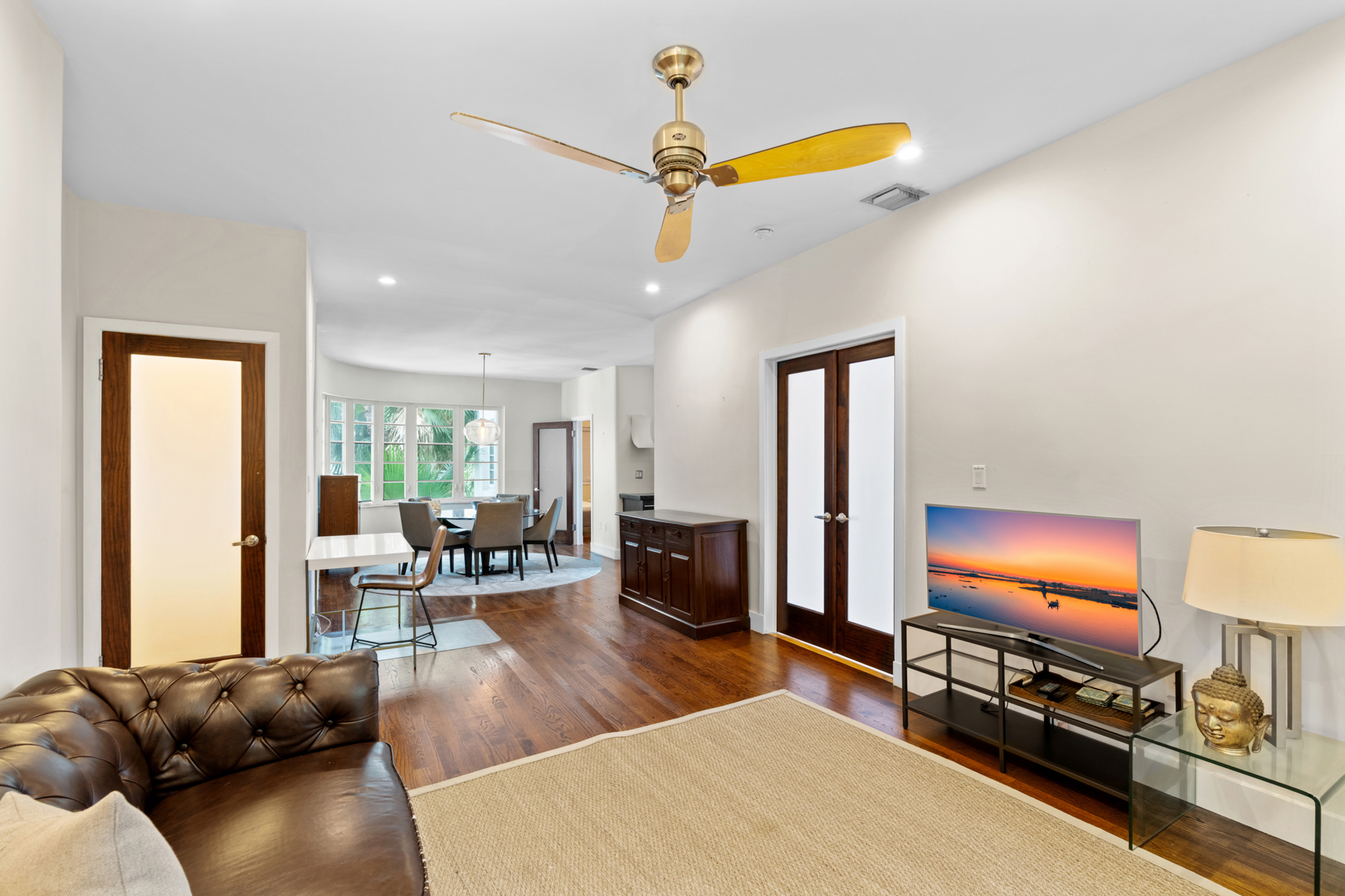 711 East 14th Street, Unit 7 Hialeah, FL 33010 - Photo 14 of 36 a living room with furniture and a flat screen tv